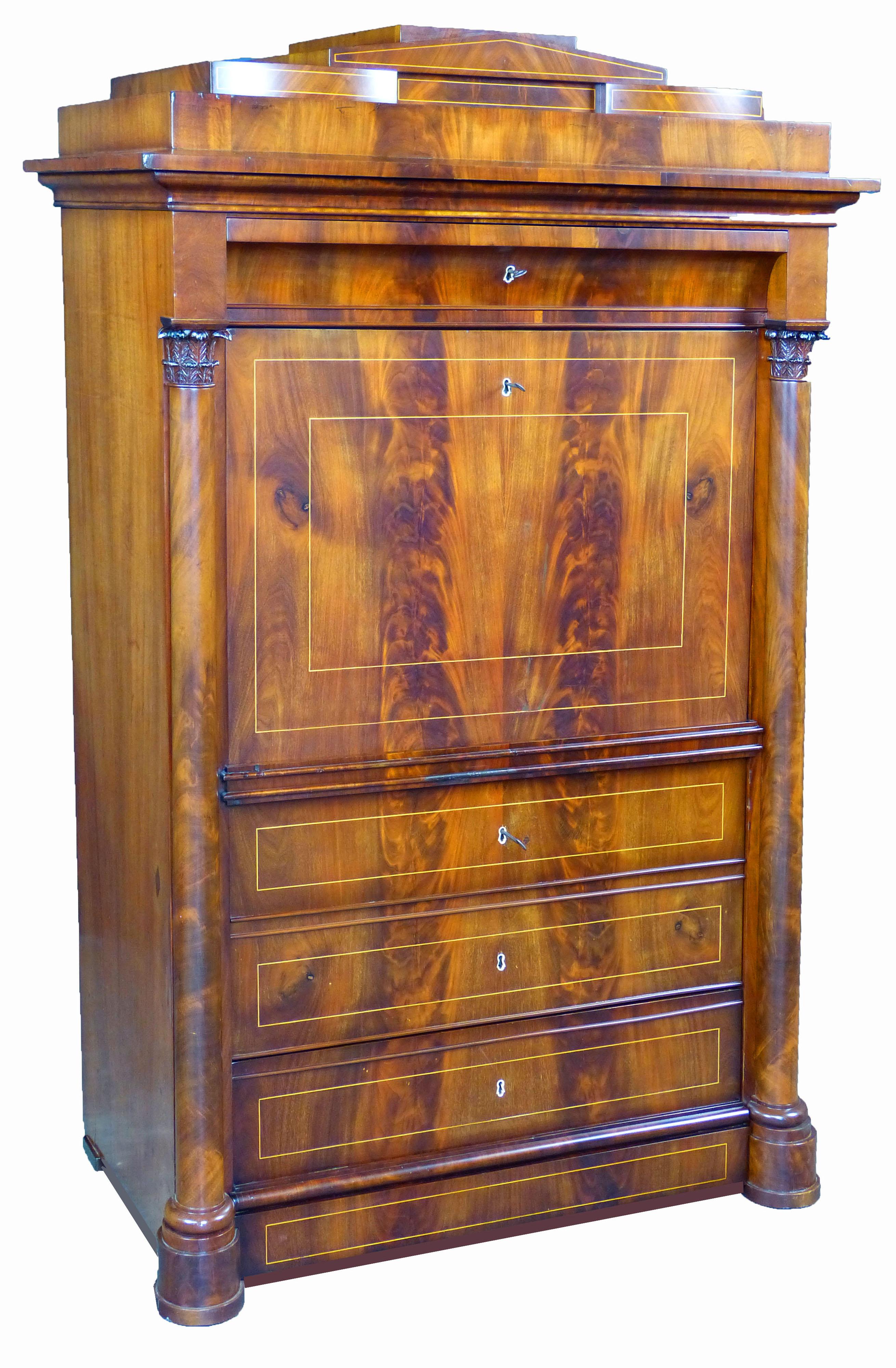 Danish Biedermeier secretaire a abattant dating to the beginning of the 19th century, featuring masterfully matched figured mahogany, line inlaid throughout and frontal columns with carved mahogany Corinthian style tops. The complex architectural