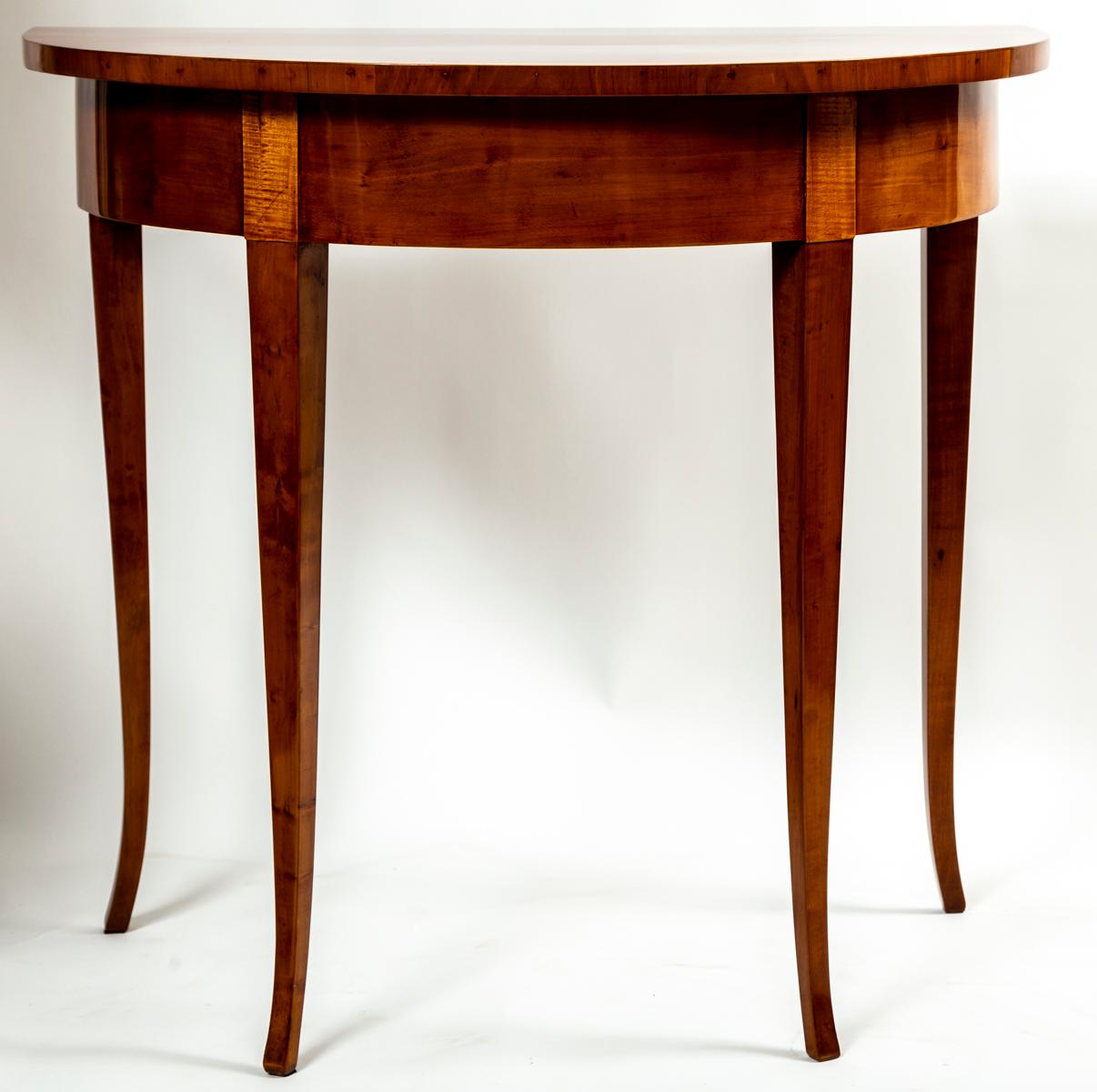 An elegantly proportioned single Biedermeier Demilune shaped console table finishing on sleek tapered legs in pearwood veneer

Origin: Austria

Dating: 1820ca

Condition: Excellent sturdy condition, re -French polished

Dimensions: 30.5″ high, 33″