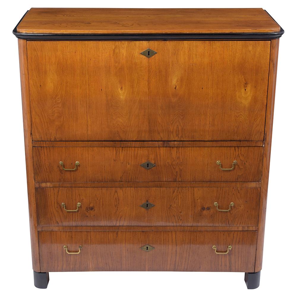 An extraordinary Antique Swedish Biedermeier Secretary handcrafted out of birch wood featuring its original light walnut and ebonized molding details beautifully finished with a clear varnish. This early 19th-century drop front desk comes with