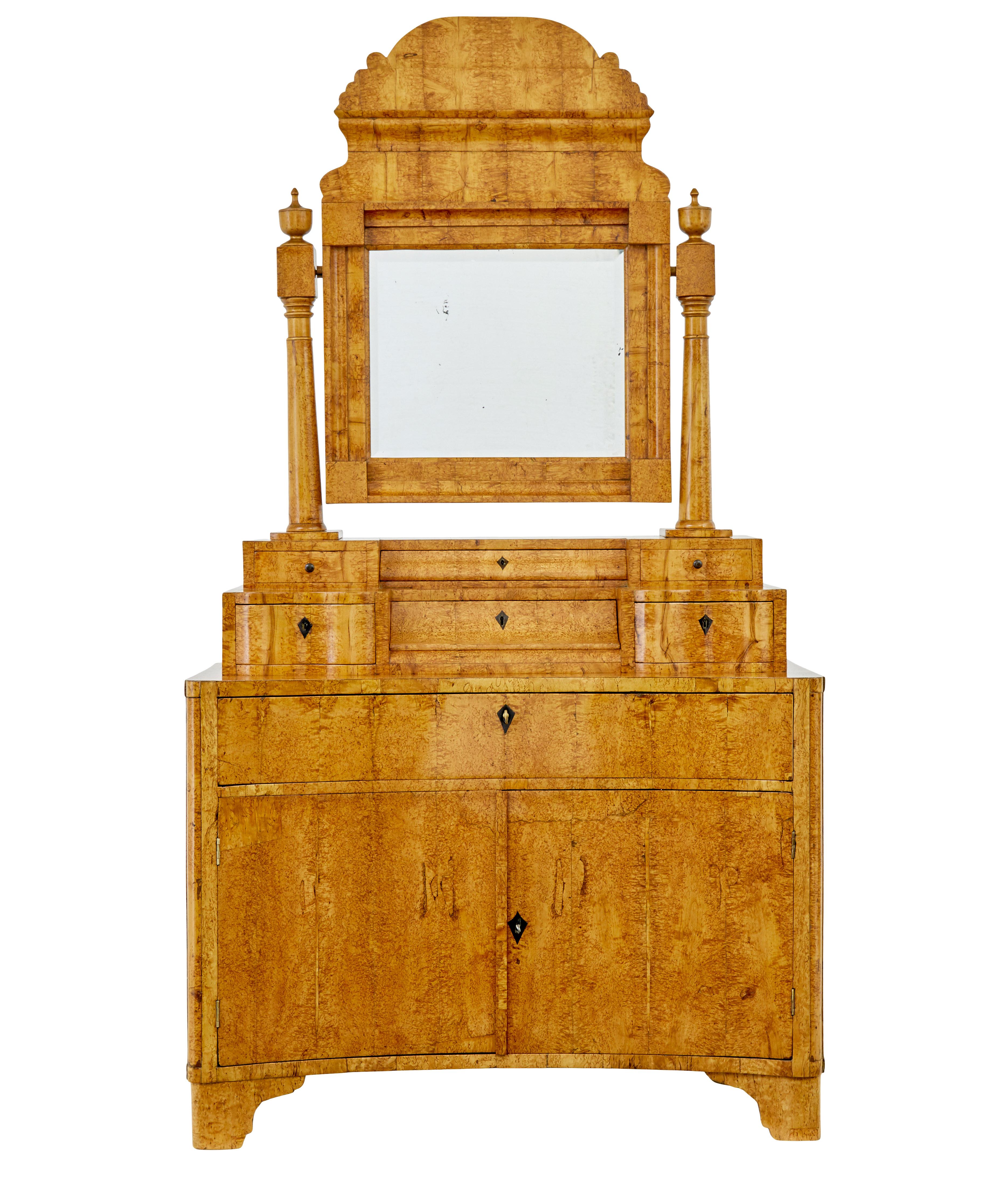 Early 19th century birch Biedermeier vanity dressing cabinet circa 1830.

Stunning piece of Biedermeier period furniture made in karelian birch.

Comprising of two main parts, although the mirror and supports are removable too.

Decorative tilting