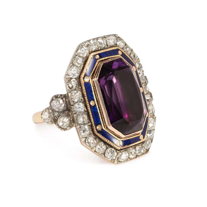 An antique Bishop's ring of octagonal design centering on a foiled amethyst in a blue enamel and old mine diamond concentric surround, in 15K gold and silver.  England.  Amethyst measures 14.75 x 9.0mm, atw diamonds 3.00 cts.

Top: 1