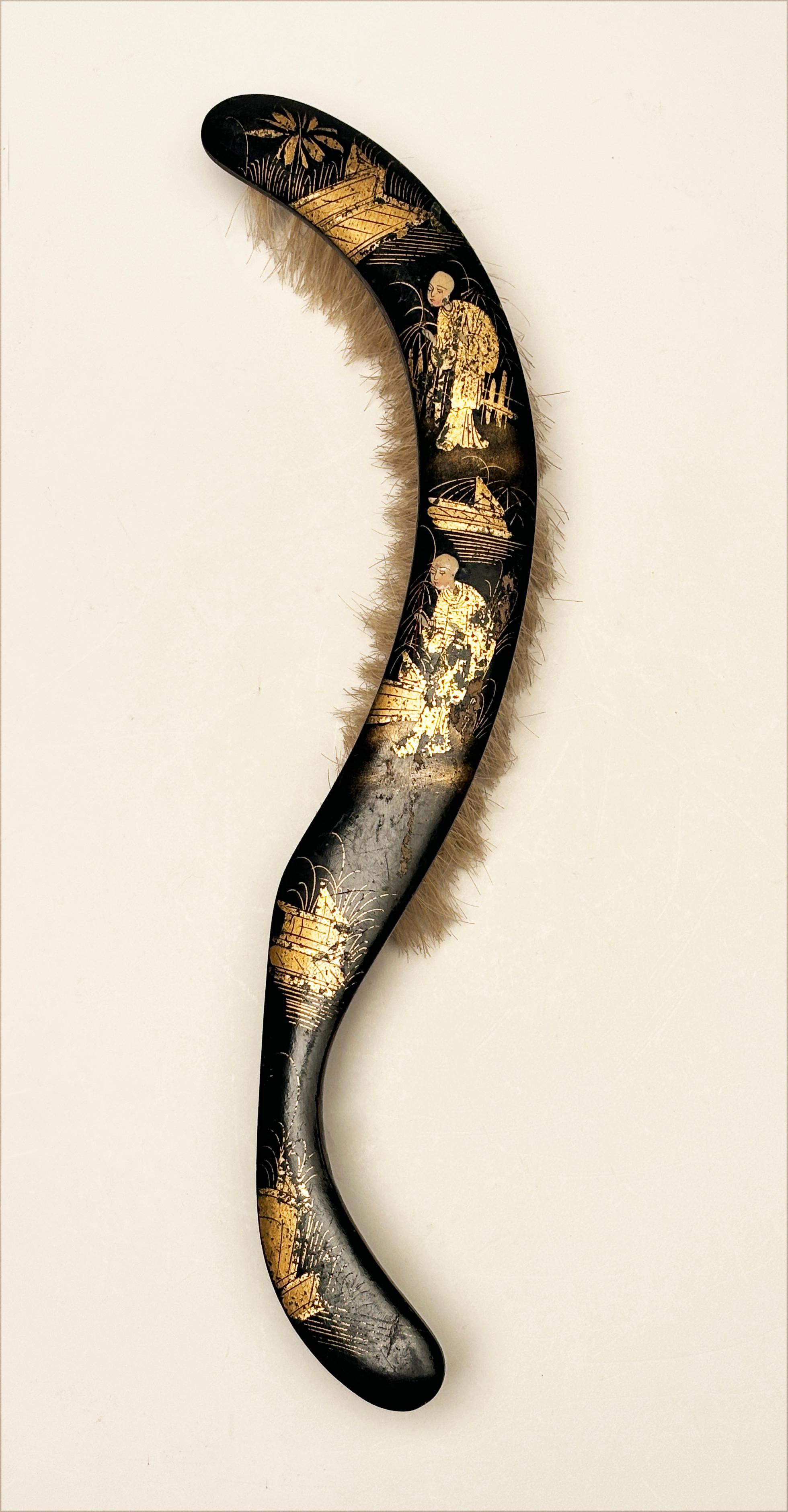 This wonderful Chinese Crumb Brush is an interesting look into the past. Made in the early 19th century, this brush is made of natural boar's hair, paper maché covered wood that is coated with a black lacquer and intricately painted with golds and