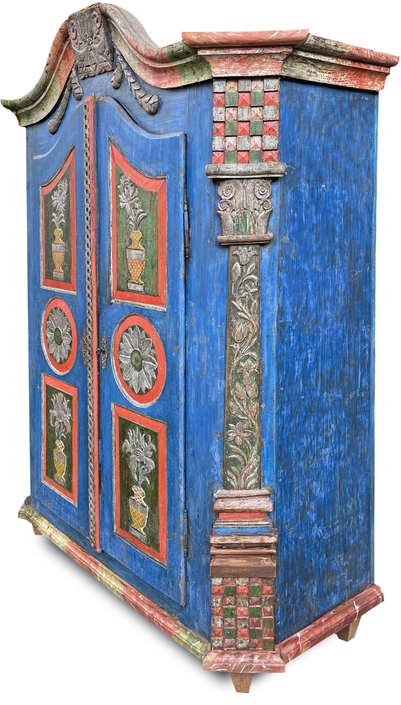 Blue painted wardrobe with rich carvings

Measures: 
H. 190 cm – W. 130 cm (147 cm to the frames) – D. 49 cm (56 cm to the frames)
H. 74,8 in – W. 51,1 in (57,8 in to the frames) – D. 19,2 in (22 in to the frames)

Central Europe painted wardrobe