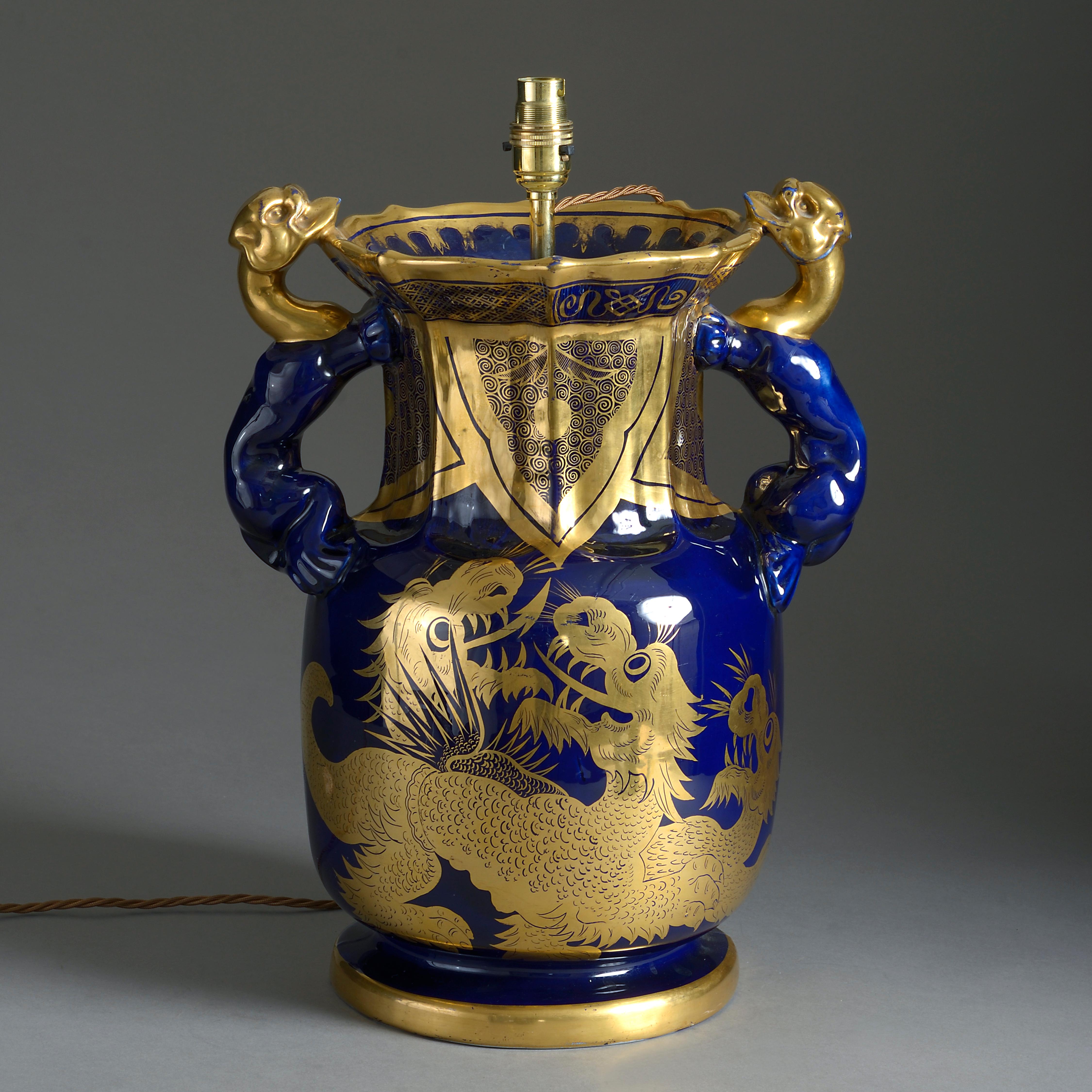 An early 19th century Mason’s Ironstone vase with scrolling handles, decorated with gilded dragons upon a deep blue gound. Now mounted as a table lamp.

Height dimension refers to antique parts only (excluding electrical components).

All lamps