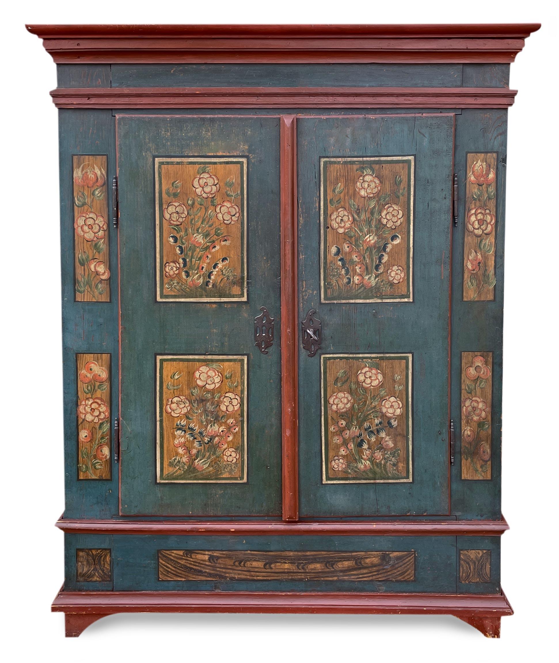 Painted Blue Tyrolean Wardrobe

H. 183 cm – L. 128 cm (140cm at the frames) – D. 49 cm (55 at the frames)

Beautiful Tyrolean wardrobe with two doors, entirely painted in deep blue, with brick red frames that create a pleasant chromatic contrast. On