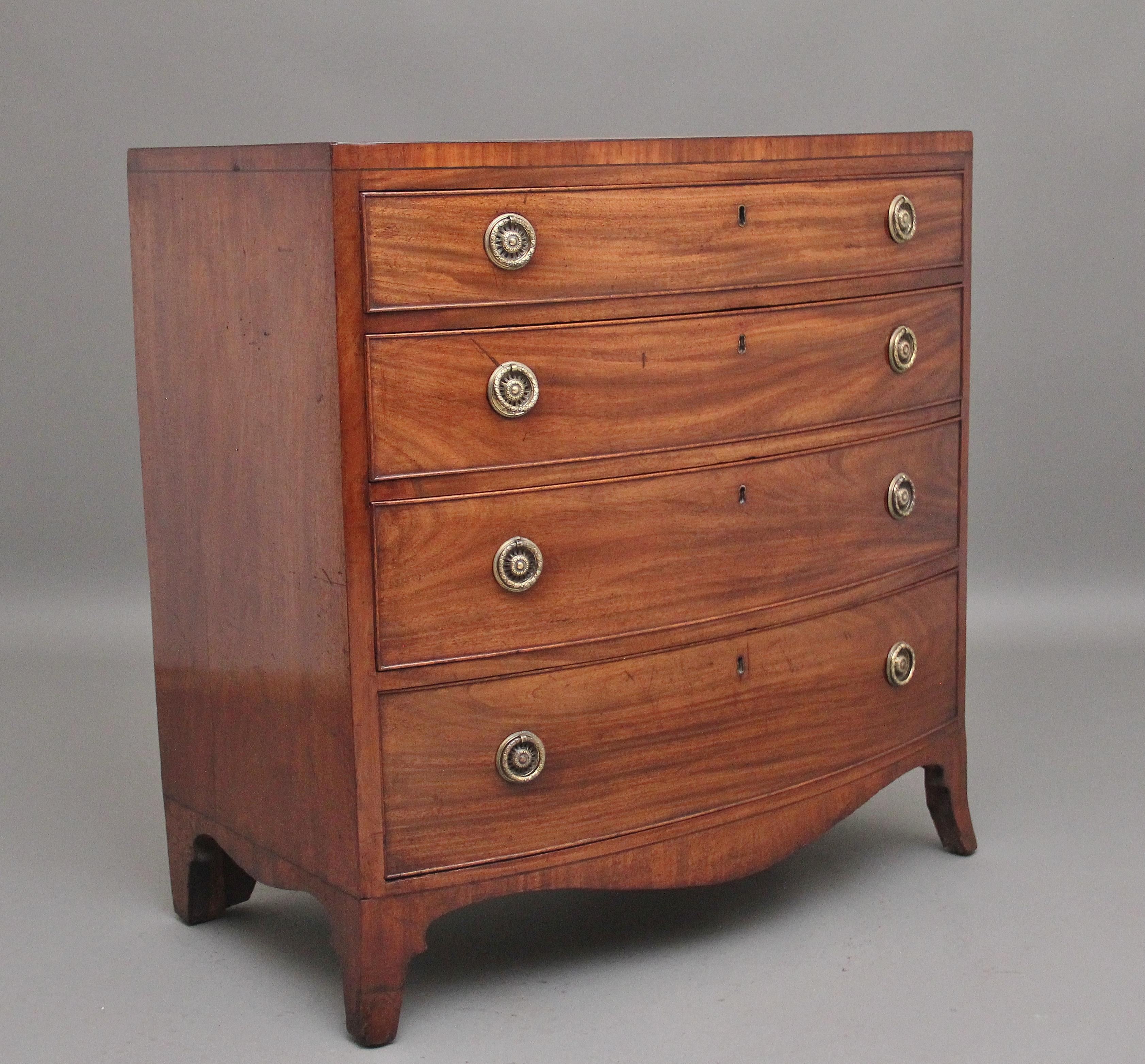 Early 19th Century mahogany bowfront chest of drawers of nice proportions, having a lovely figured and crossbanded top above a selection of four long oak lined graduated drawers with pierced brass ring handles, having wonderful figuration on the