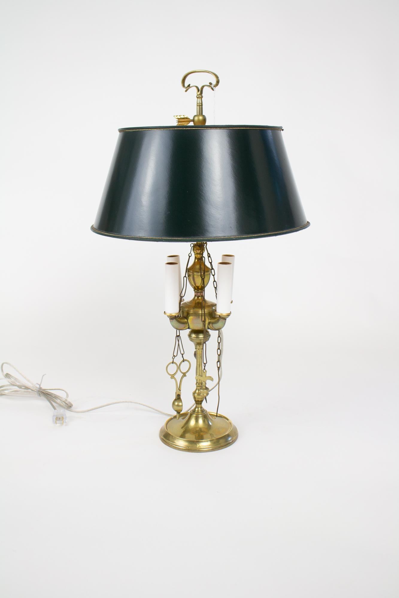 Early 19th century brass electrified lucerne whale oil lamp. A popular style of lamp in the late 18th-early 19th century, the lucerne burned whale oil or olive oil. From a central repository, there were four burners where a wick was placed. Hanging