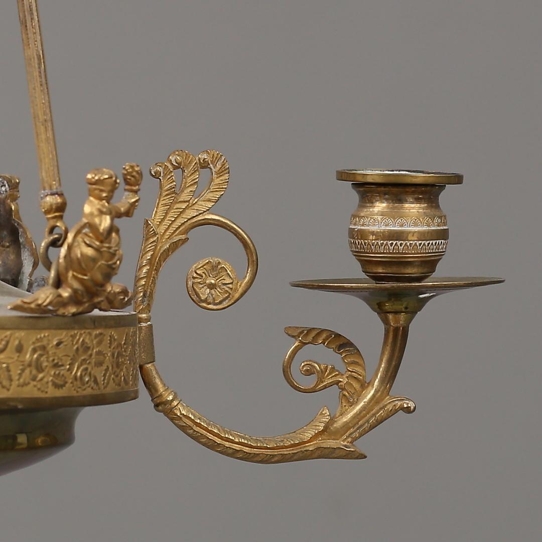 Araña de latón de principios del siglo XIX para cuatro velas

Altura: 65 cm
Diámetro: 45 cm
Latón 

Esta lámpara Imperio, un elegante complemento para cualquier habitación o entrada, tiene capacidad para 4 velas y crea un romántico resplandor cuando