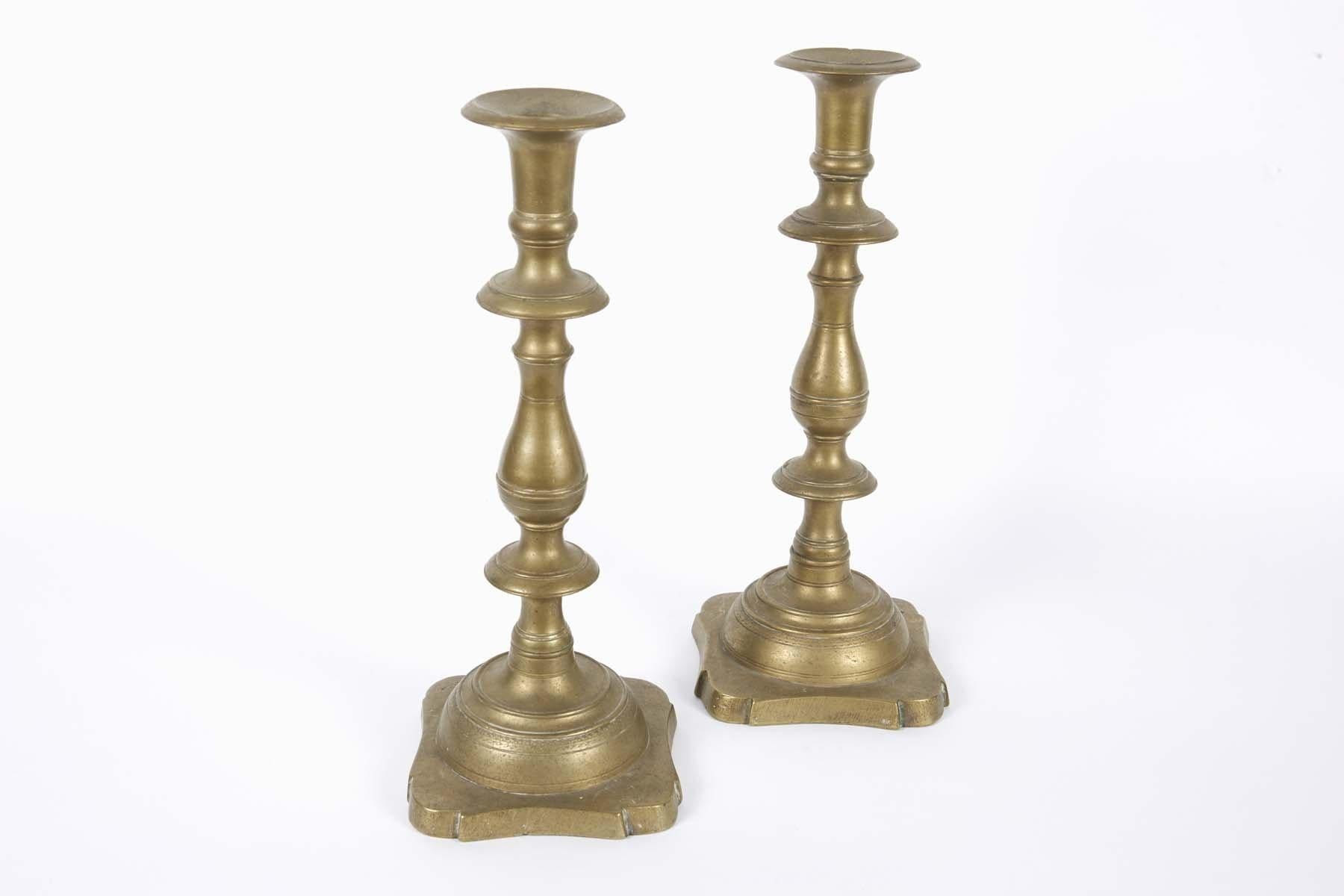 Early 19th century Russian/ Polish brass Sabbath candlesticks.
Base with trefoil motif and banding, with bladed knops and ample bobeche.
Hand turned screws for disassembly.
Used by Jews located in the large swath of territory known as the “Pale