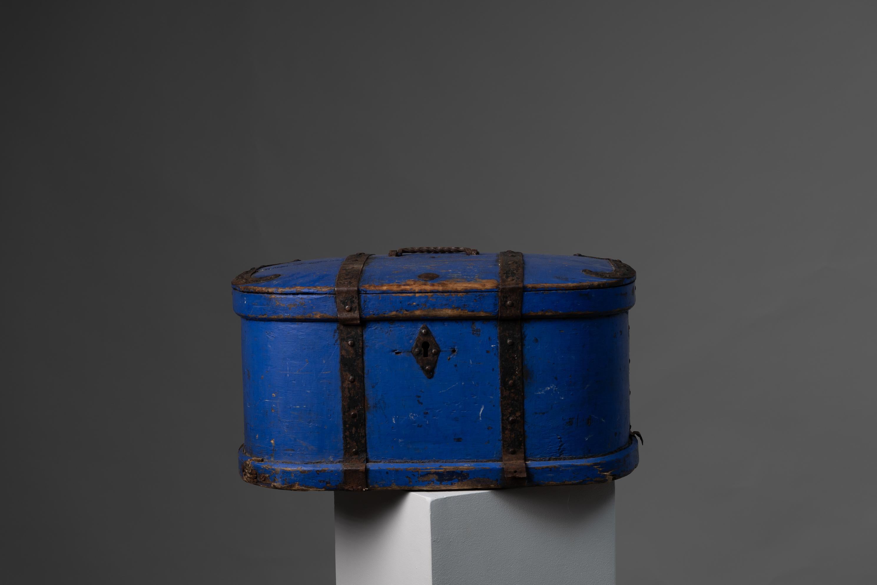 Swedish hand-made antique blue traveling box from the 1820s to 1830. This charming little box has bright blue original paint and hand wrought hardware in iron. The box was used to storage valuables when travelling, hence the sturdy iron hardware. It