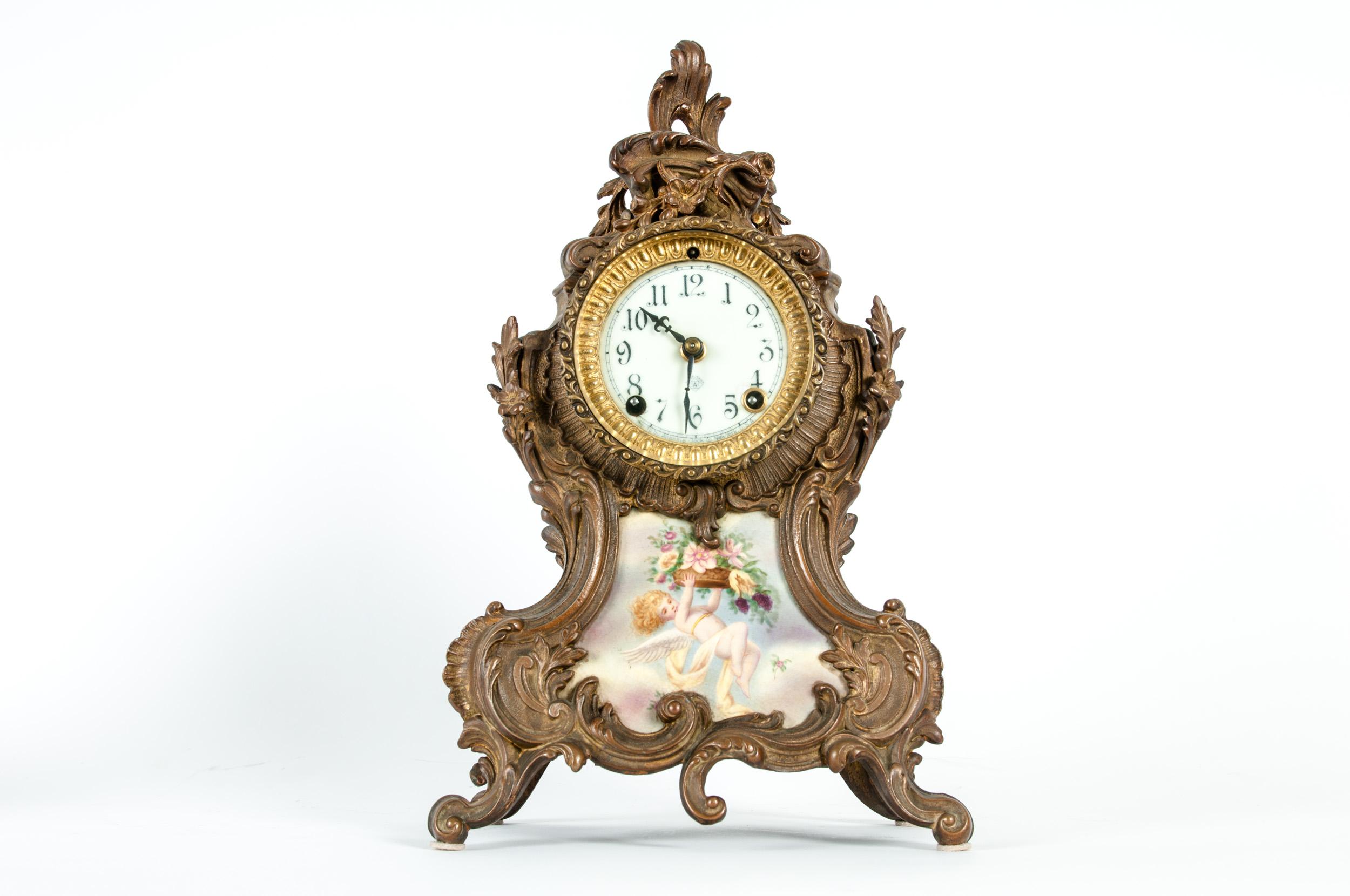 Early 19th century bronze mounted porcelain face Louis XVI style North American desk clock. The clock is in great antique condition with wear appropriate to age / use. The clock measure about 15 inches high x 8 inches wide x 4.5 inches deep.