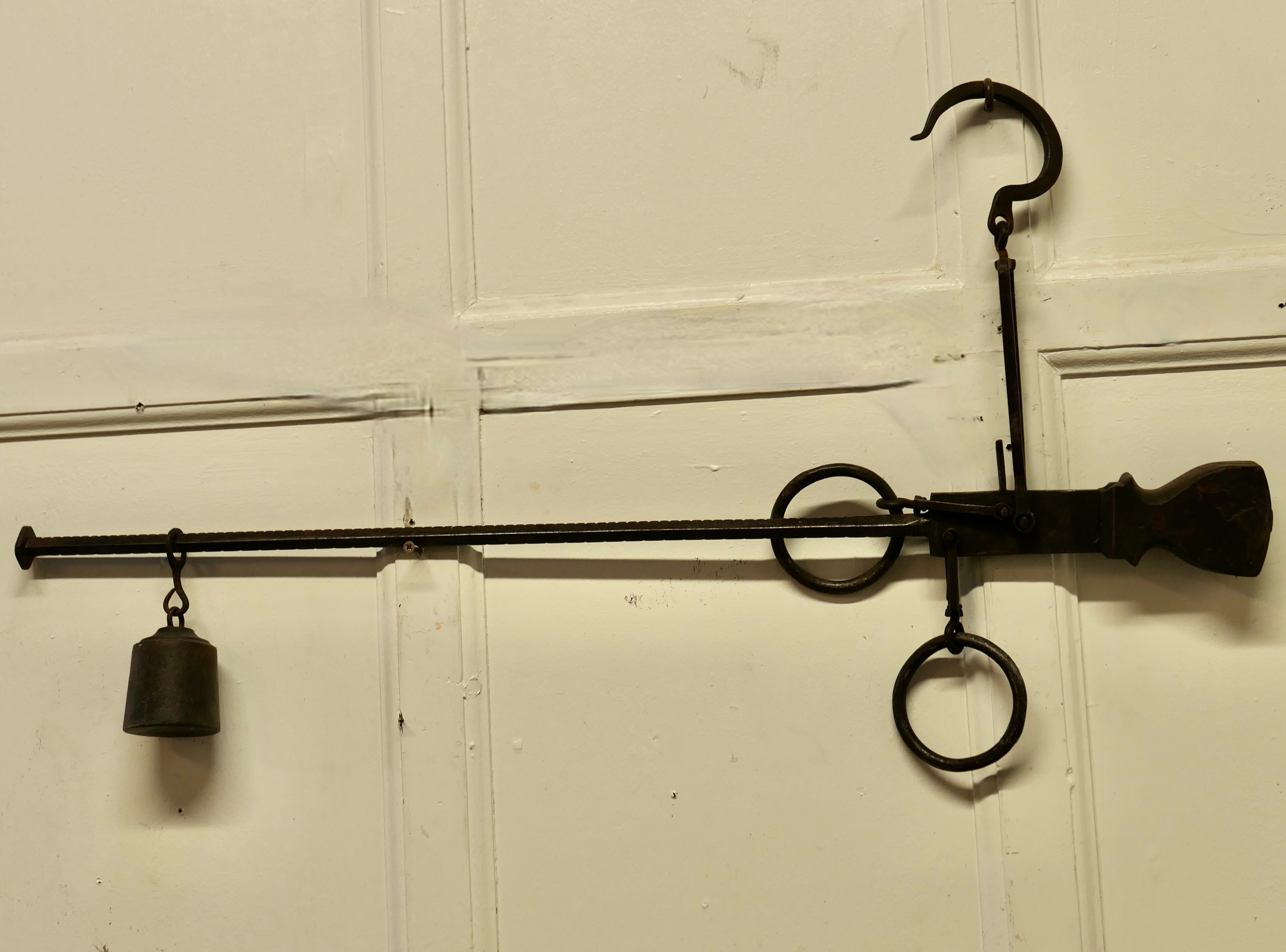 Early 19th century butchers steelyard for weighing scale.

A good original industrial piece, the balance has blacksmith made sliding hook for adjustment of balance weight.
The Steelyard is 36” long.
THM188.