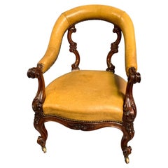 Early 19th Century Carved Mahogany and Tan Leather Armchair with Brass Castors