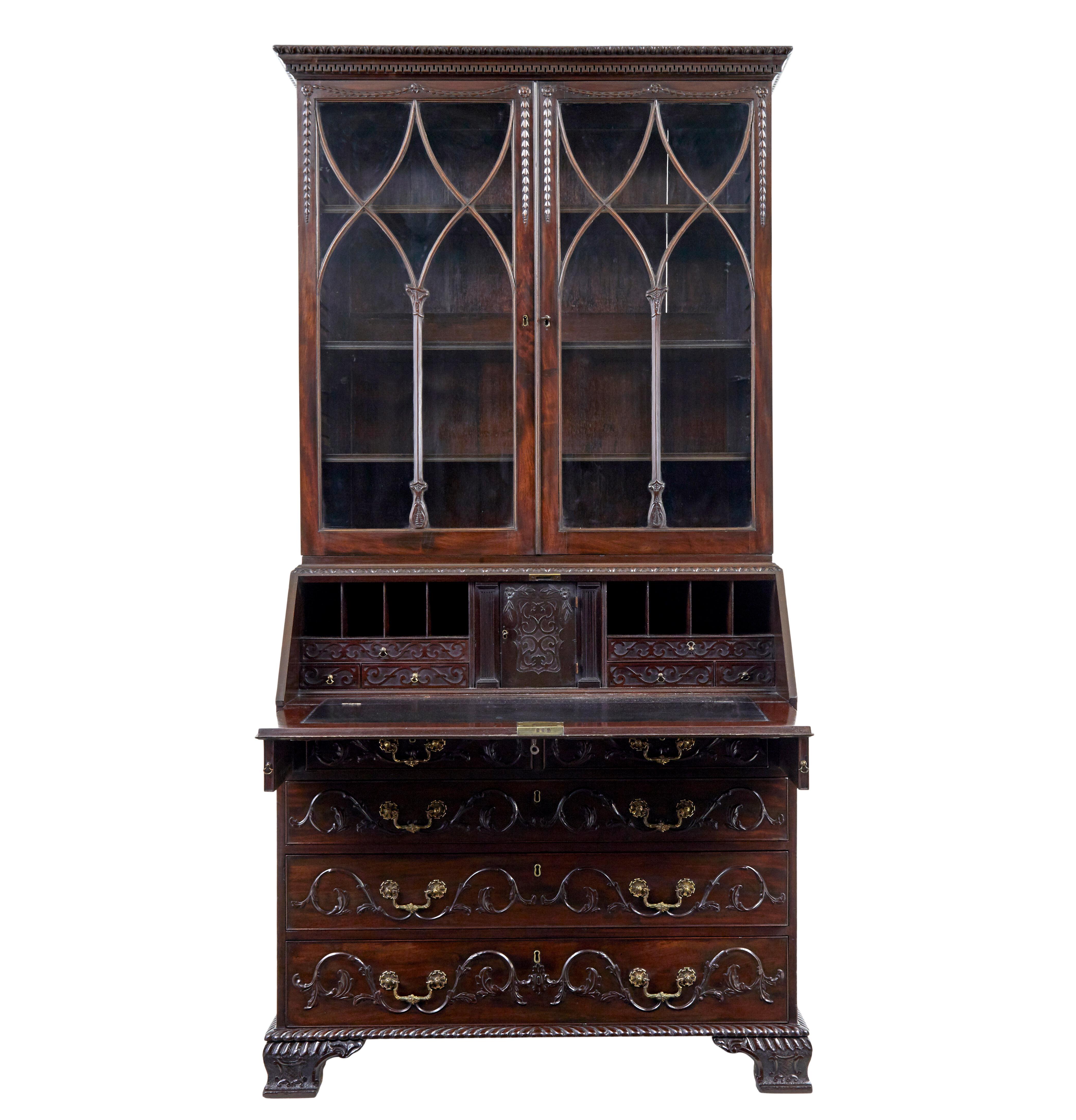 Early 19th century carved mahogany bureau bookcase circa 1820

We believe this piece to be English but could be also be irish. In 2 parts, the top part with original glazing set in gothic astral wood work, 3 adjustable shelves. Harvest and musical