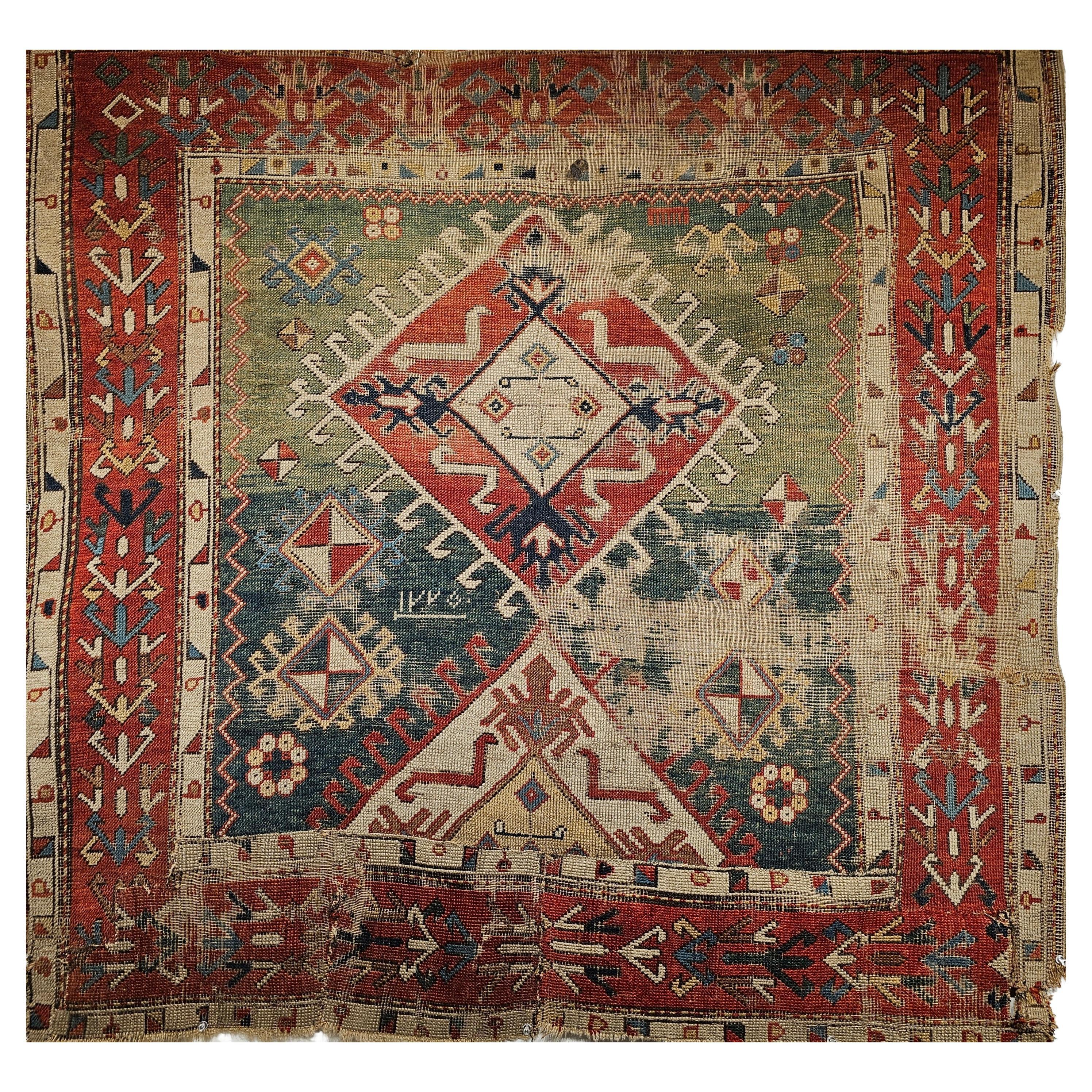 Early 19th century Caucasian Shirvan square area rug in an abrash green, blue, yellow, and red. The Caucasian Shirvan rug is from the 1st/2nd quarter of the 1800 and and the date is woven in the rug.  Looking at the date in the center of the rug
