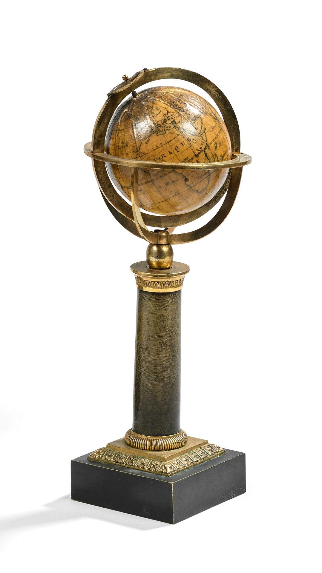 CELESTIAL TABLE GLOBE supporting a gilded and patinated bronze base, it features four quadrants on which is fixed the horizon materialized by a ring with longitude graduations, the signs of the zodiac, the months and a compass rose.
The geographical