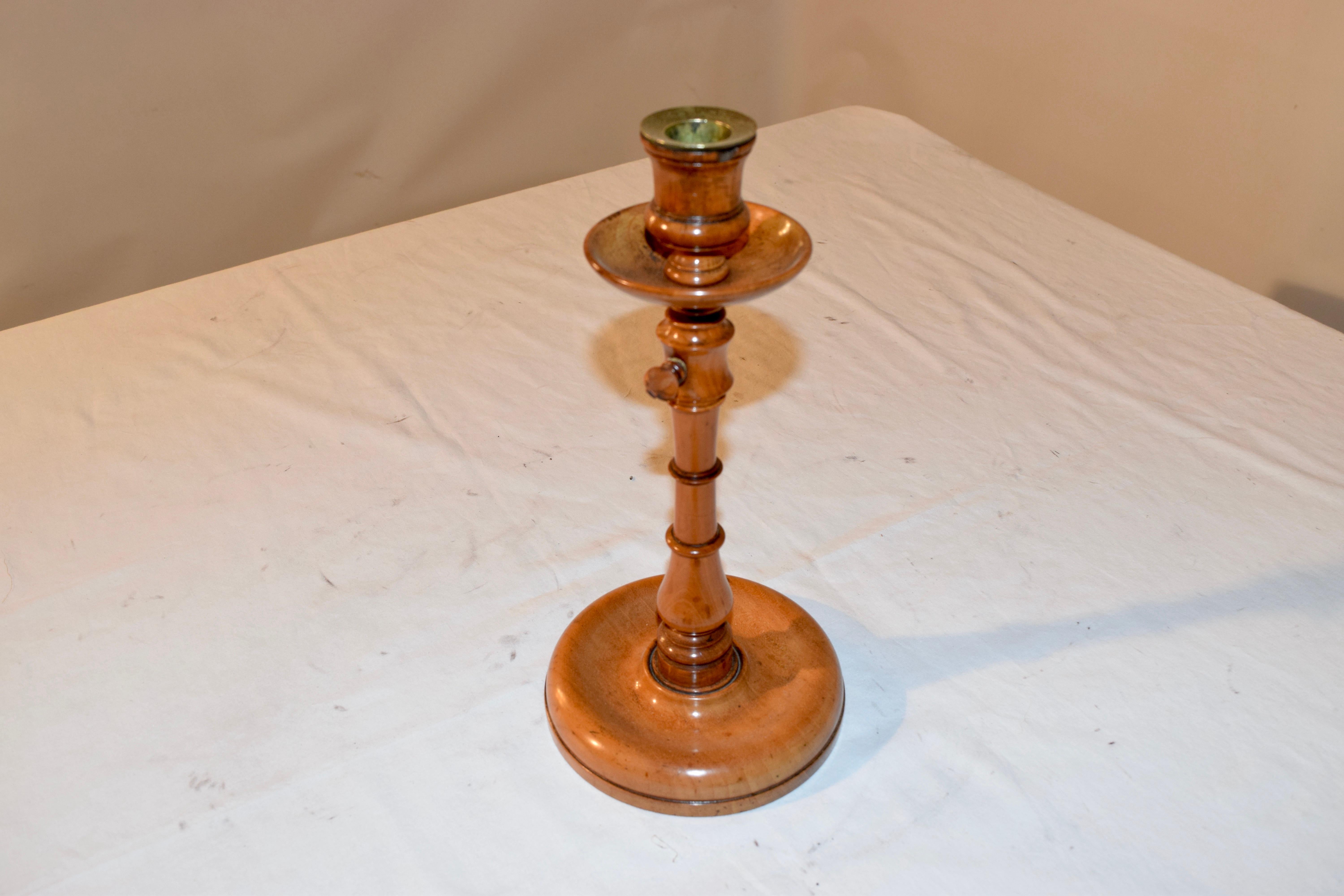 Early 19th century candlestick from England with lovely hand turning and a telescopic stem for tasing and lowering the candle height.