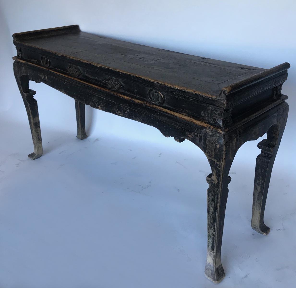 Dark elm, graceful Qing altar table from 19th century China. Geometric and stylized floral applied details on apron. Carved, elegant cabriole legs. Dark patina is all original and age appropriate wear. Sturdy and functional as a console.