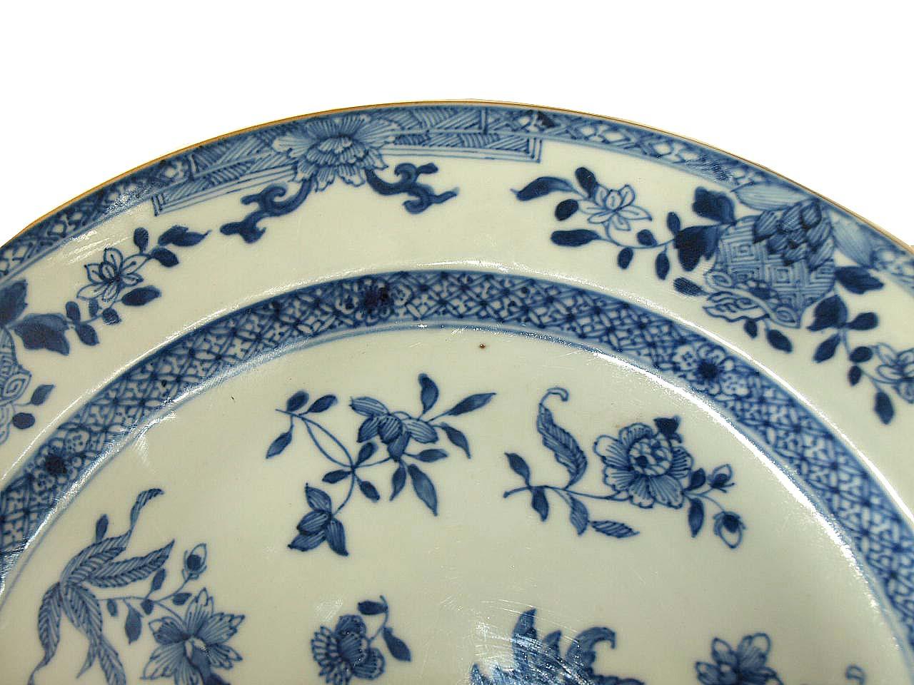 Early 19th century blue and white charger, featuring a multitude of stylized flowers and foliate. This piece is in very good condition, absolutely no nicks or any issues.
