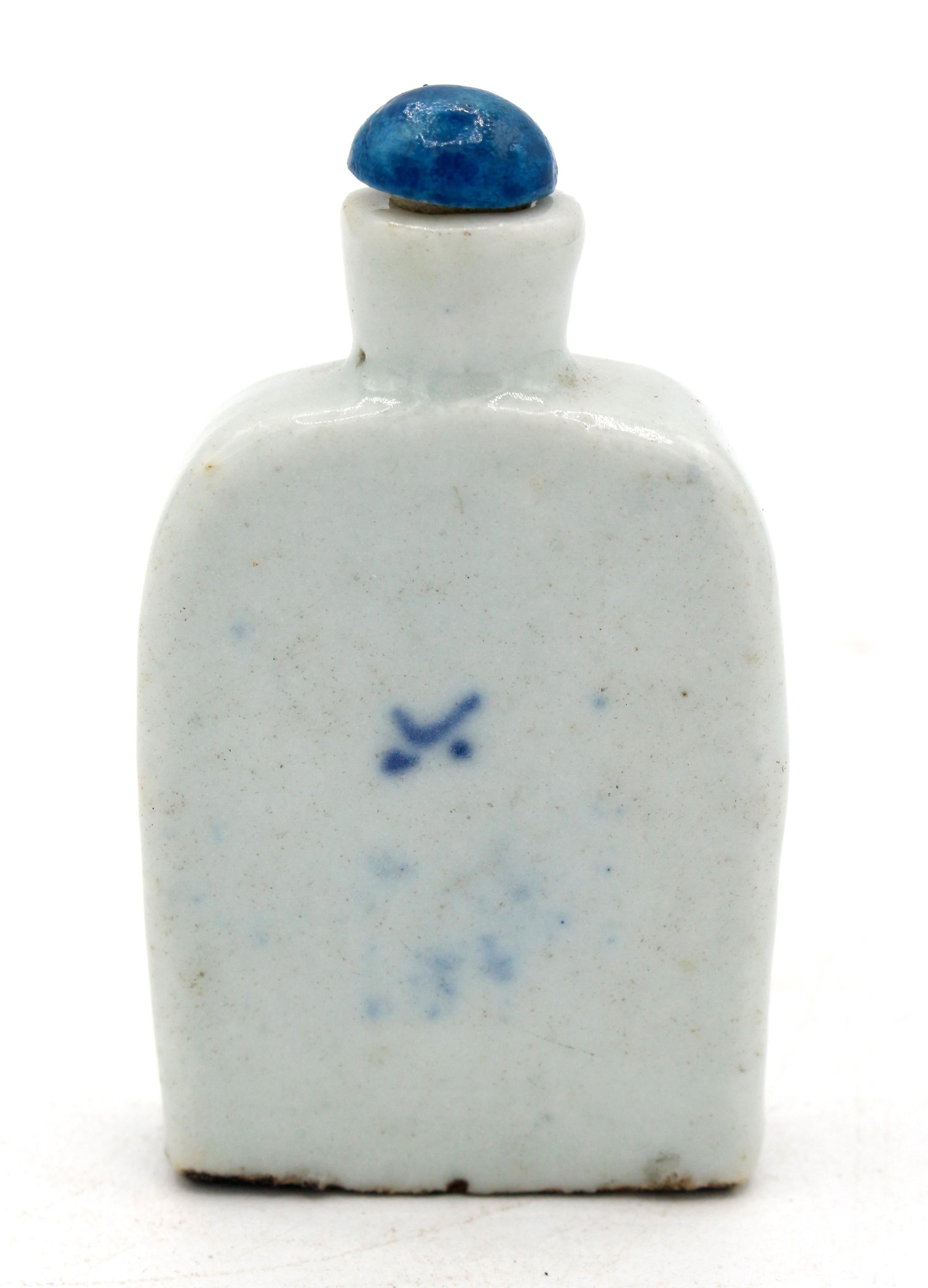 Early 19th century Chinese blue & white snuff bottle. Porcelain; slope shoulder form. Qing dynasty. Landscape underglaze decoration. Signed on back. Modern stopper.
2.75
