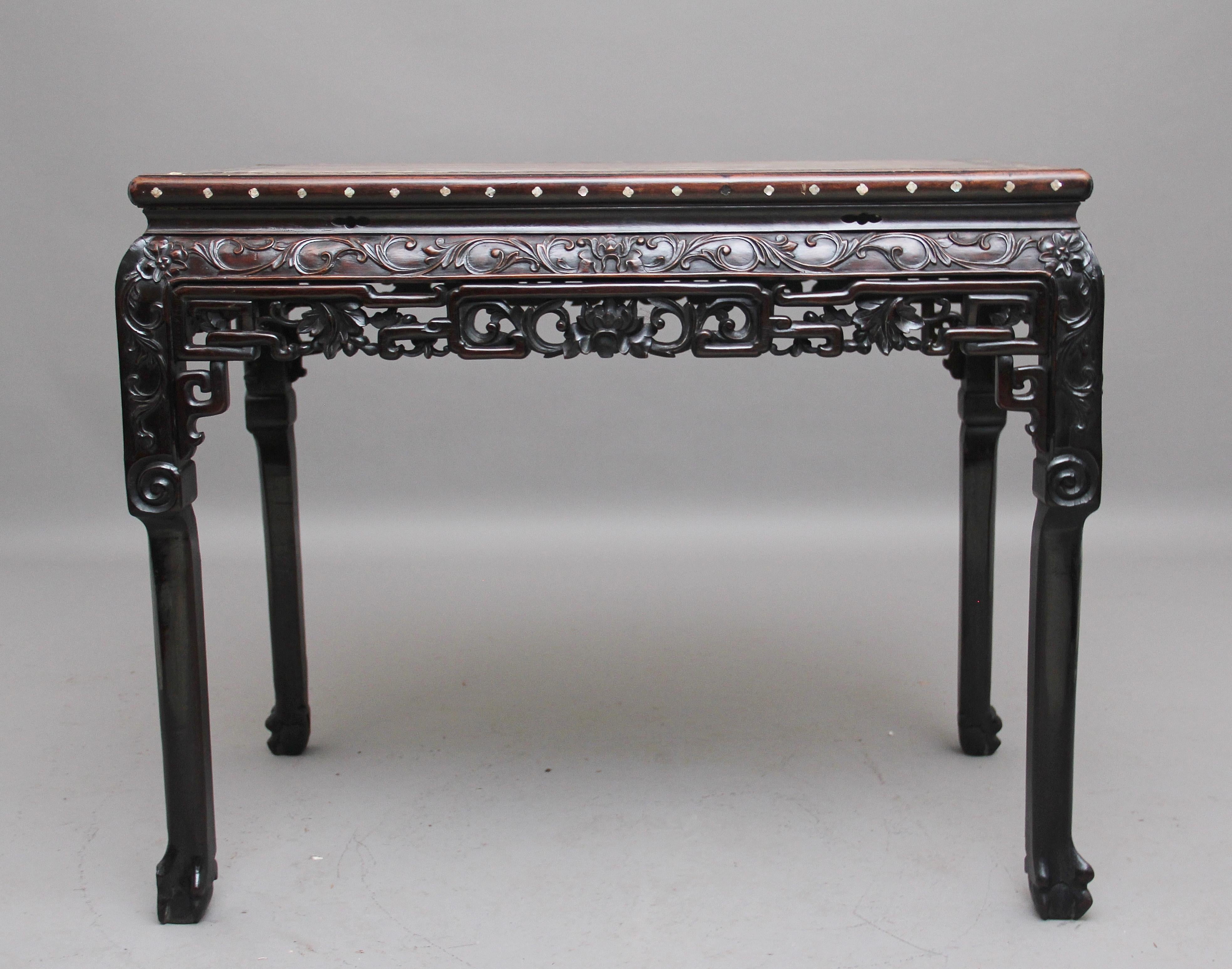 A superb quality freestanding early 19th century Chinese marble top side / centre table, the rectangular top inset with a rouge marble panel, the hardwood border of the top profusely inlaid with mother of pearl floral patterns, there is also mother