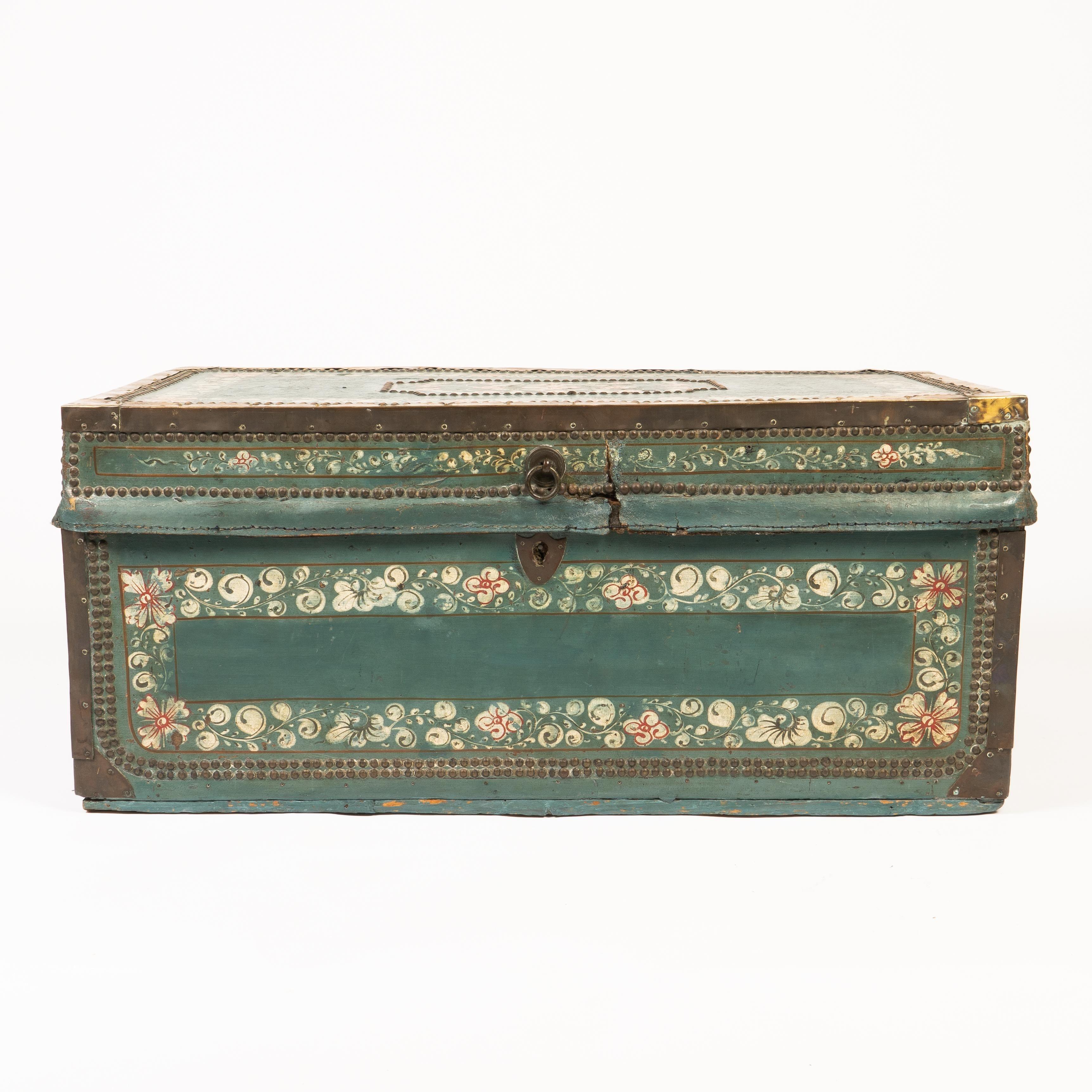 Decorated blue leather covered camphor wood trunk, bound with brass and mounted with cast brass bail handles.

China, made for the Western Trade, circa 1825.