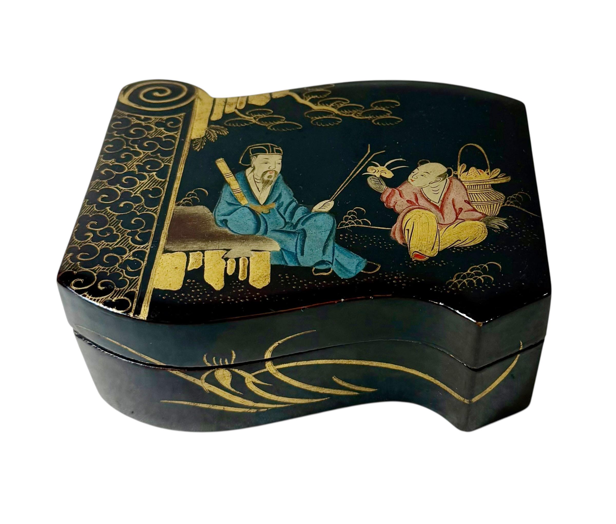 An early 19th century Chinese lacquer box, originally crafted as the interior compartment of a much larger box. Beautifully decorated and in remarkably good condition for its age, it features an elegant court scene on the lid depicting an emperor