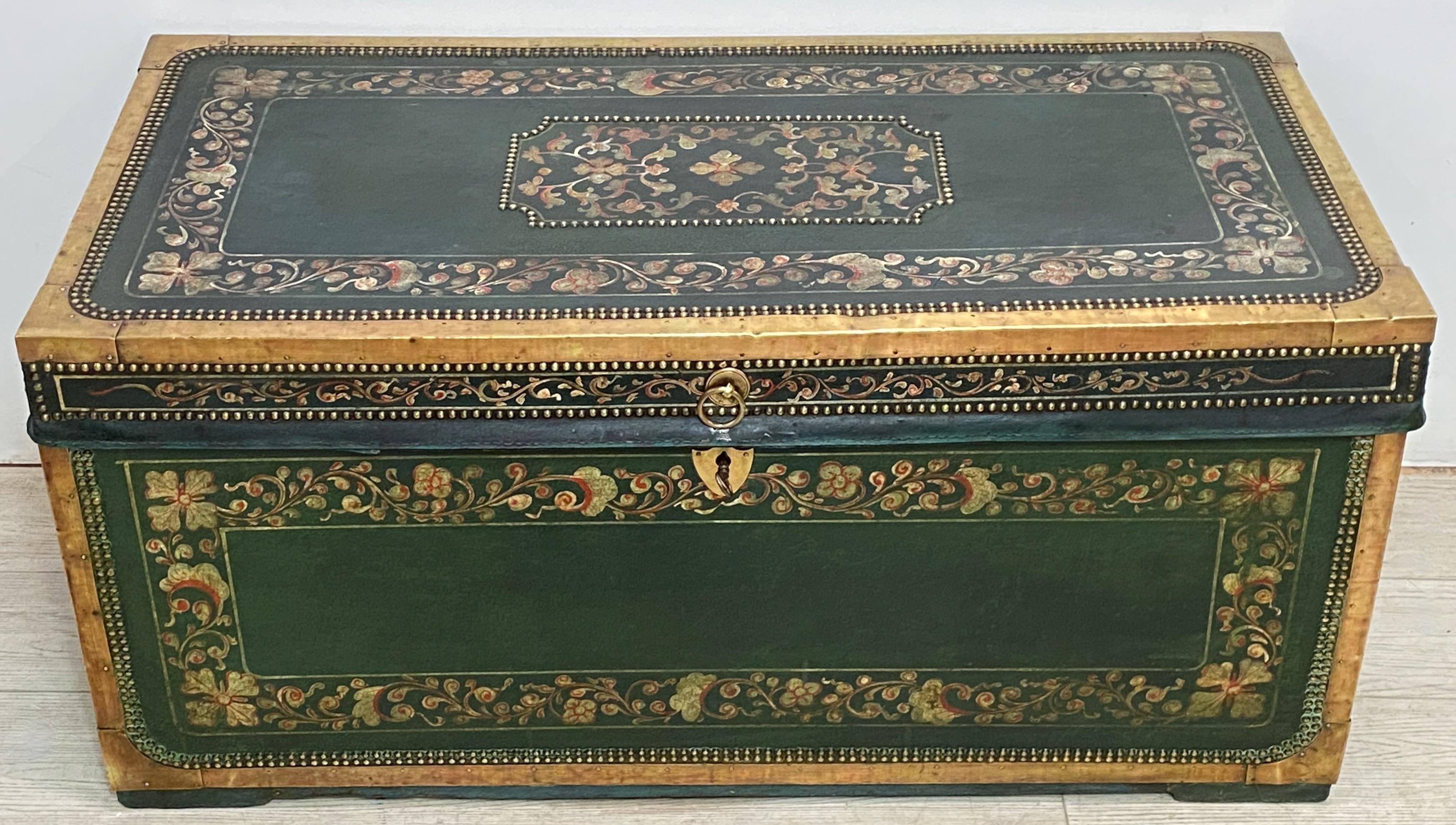 An exceptional and difficult to find green leather camphor wood trunk with hand painted floral decoration and brass detail.
Makes for an interesting and useful coffee table.
All original and recently refreshed. 
In excellent antique condition.