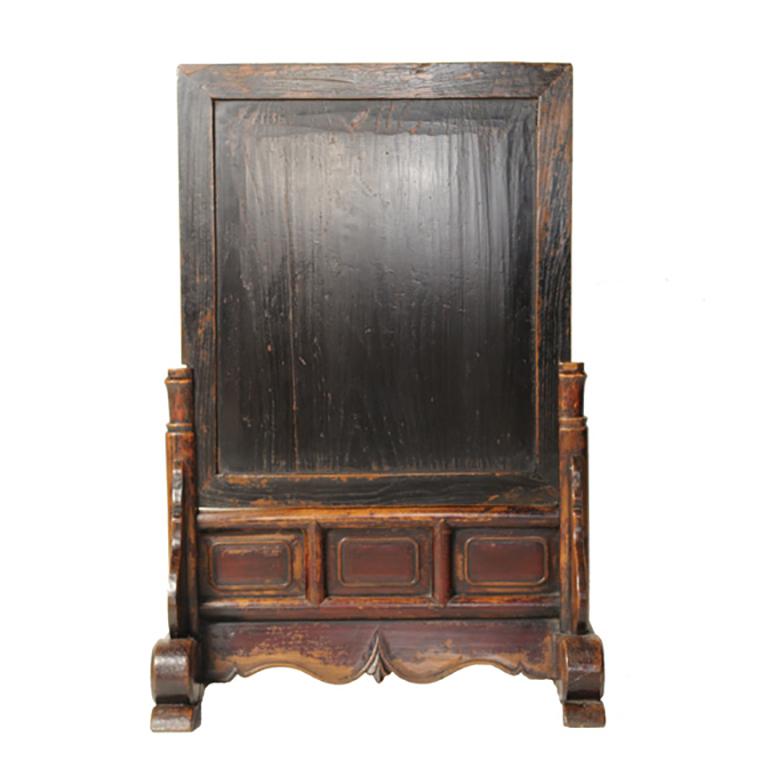 This 19th century spirit screen from northern China is inset with a duan stone, similar to stones used to create many inkstones for calligraphy. The Stand is carved with abstract clouds and auspicious ruyi symbols. Traces of its original dark