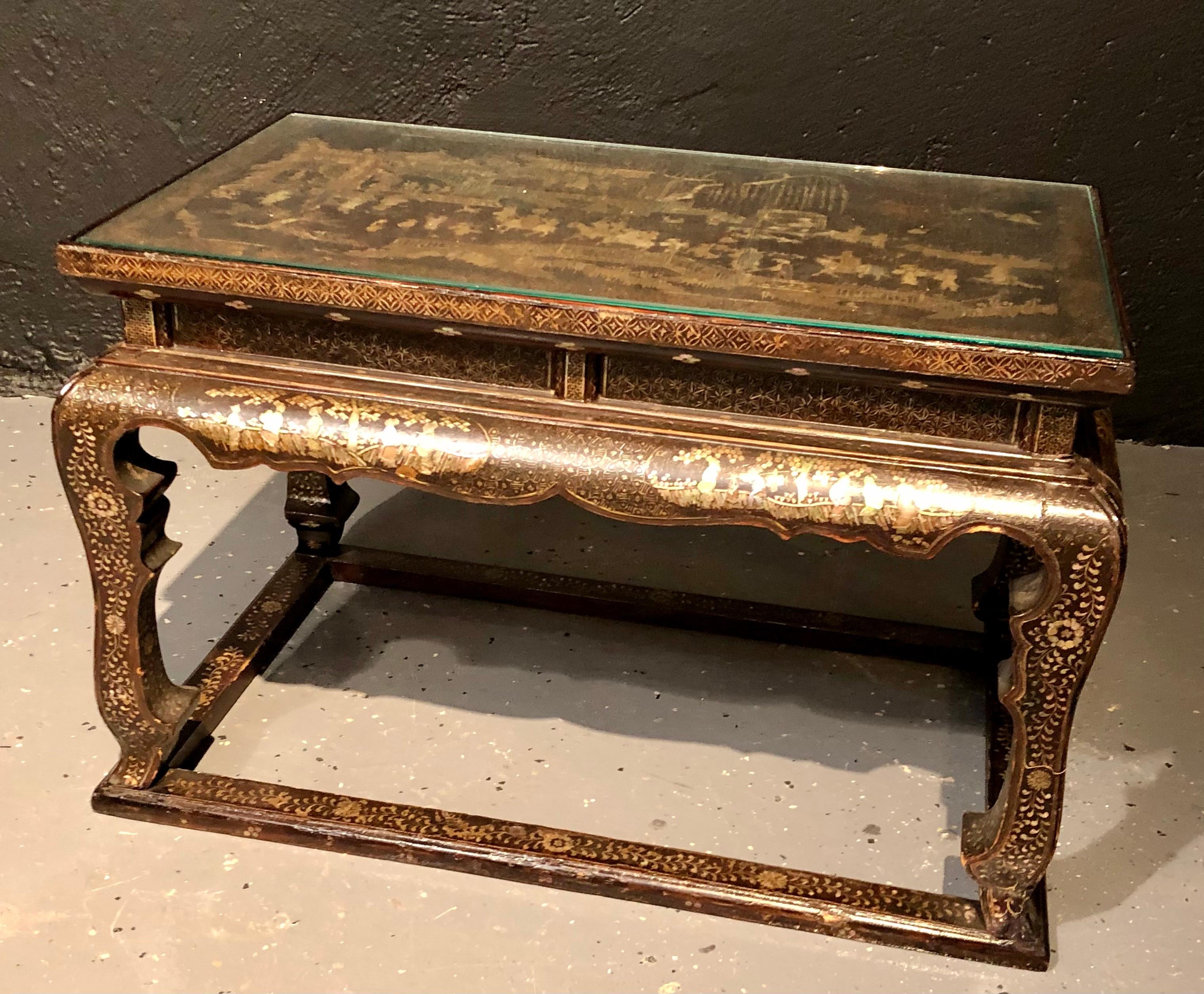 Early 19th century chinoiserie decorated side, coffee table or stool, having mother of pearl inlay. This diminutive end or side table can be used as a stool or coffee table and is as sweet as one could wish for with finely decorated figures and