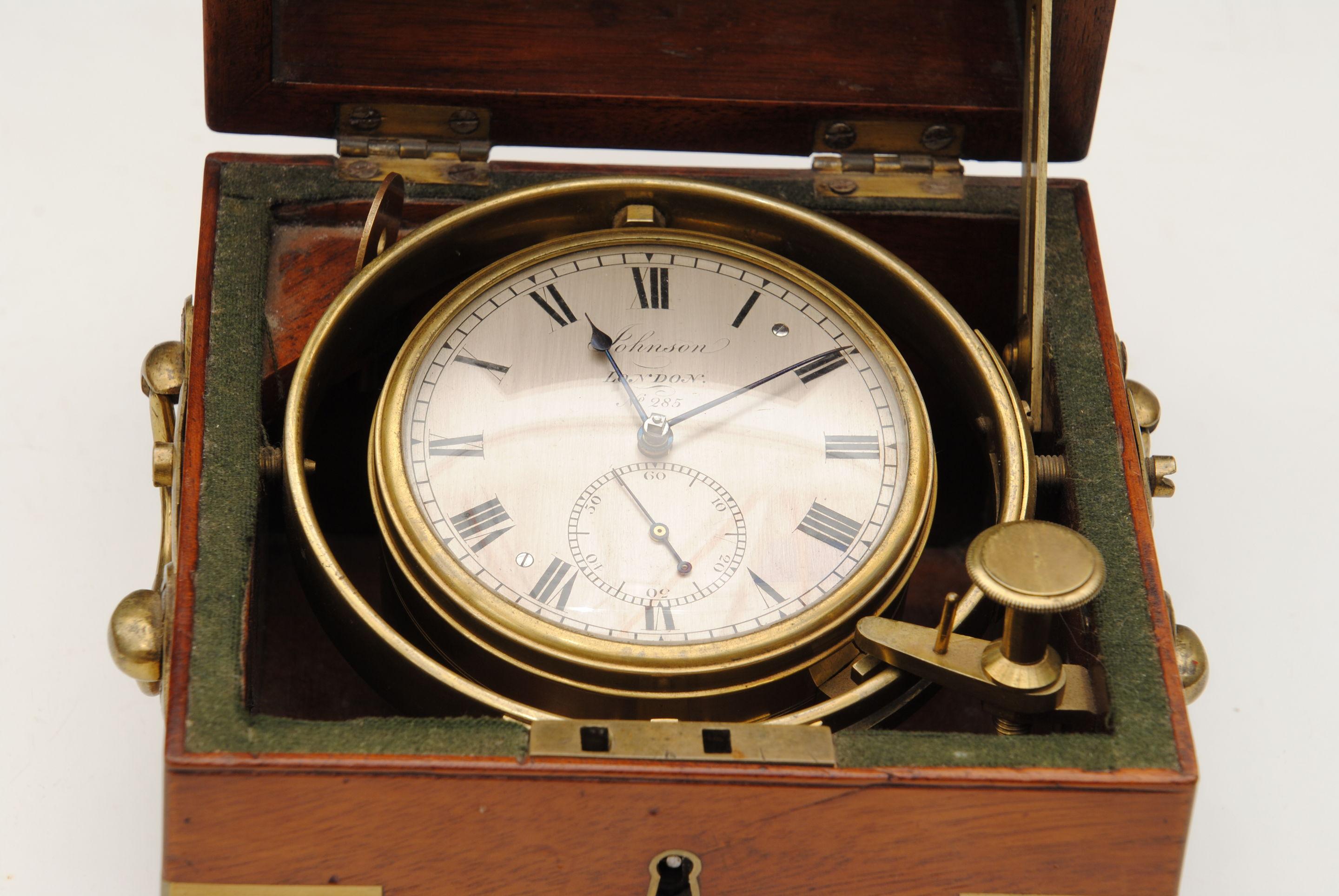 A lovely example of a small early 19th century two day marine chronometer by Johnson, London. In a brass bound mahogany three-tier case and housed in brass gimbals.

       