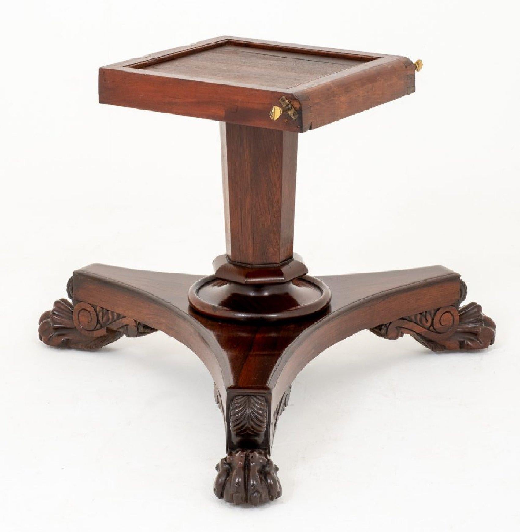 This superb early 19th century circular breakfast table is rosewood and is supported on a tri form base with a central column. The table features a lovely detailed edge on the top and ornate hairy paw scrolled feet on the base. It measures 54 in -