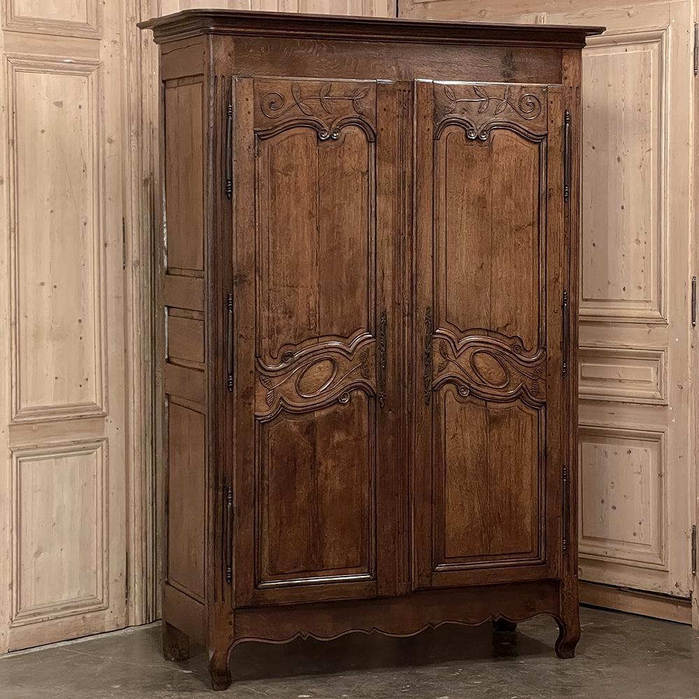 Early 19th century country French Armoire is a prime example of one of the most important historical developments in the world of furniture. Back before the days of closets in every room, the armoire provided needed storage, and provided it in