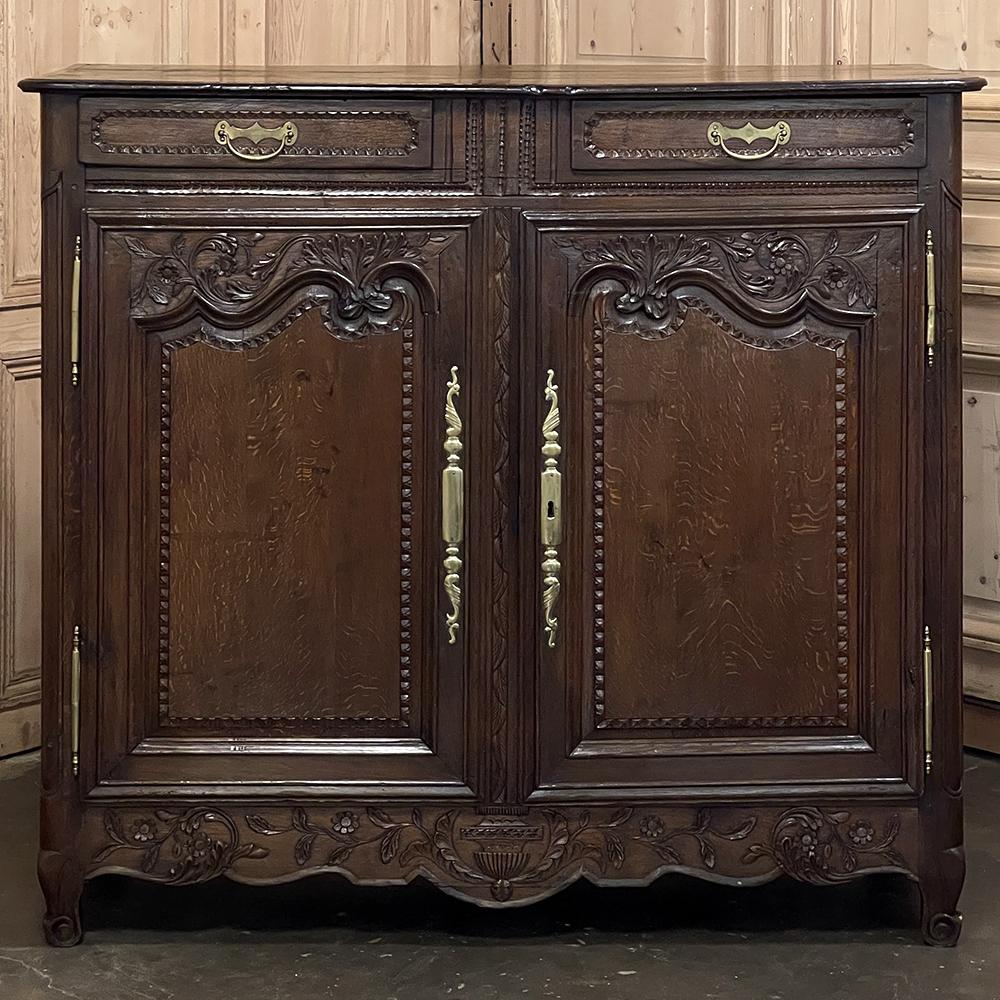 Early 19th Century Country French Buffet from Normandie was designed to serve a large home, and provide adequate storage for all china, flatware and glassware belonging to the family, and to do it with classic French flair! Constructed from