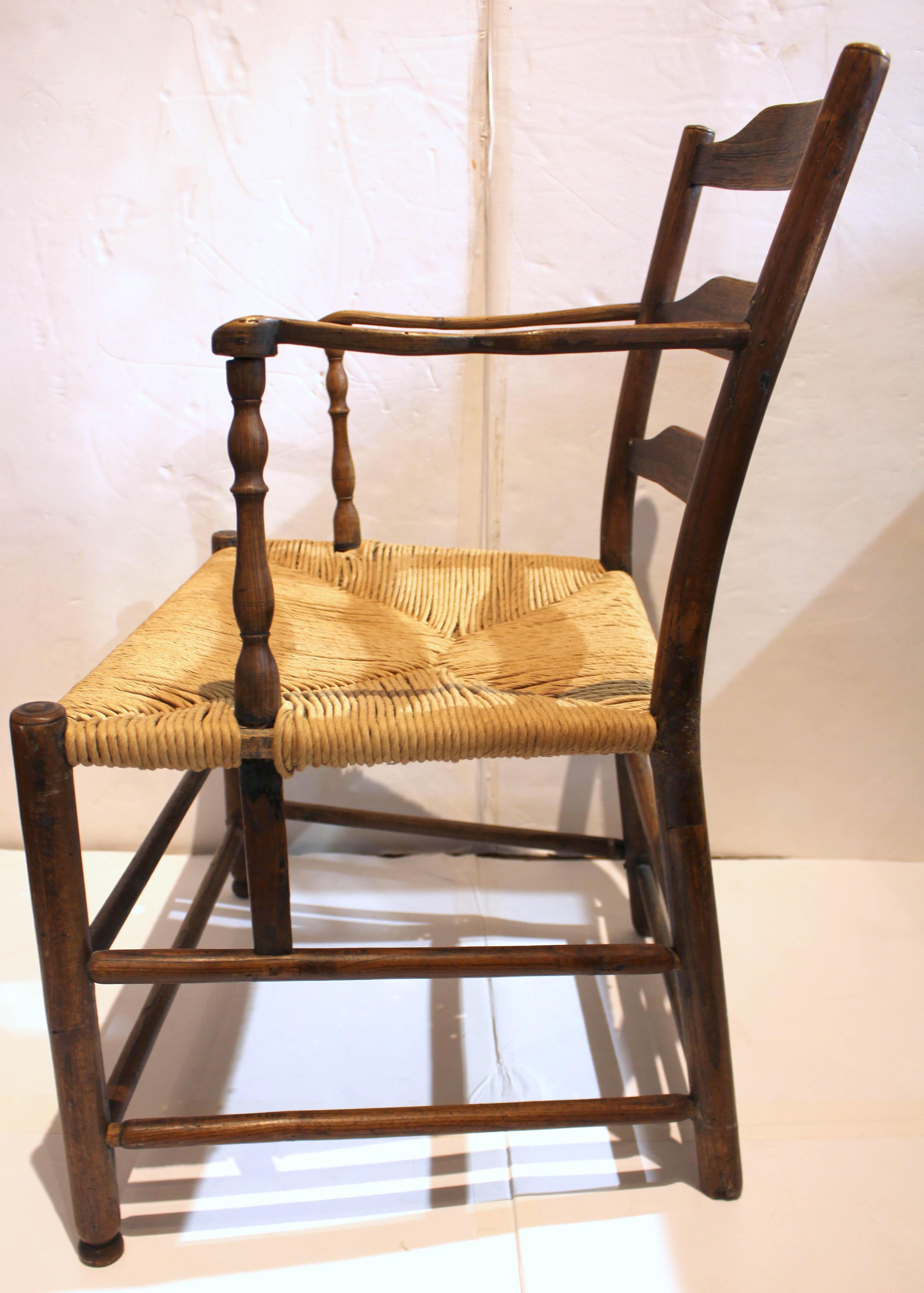 Turned Early 19th Century Country French Ladder-Back Arm Chair For Sale
