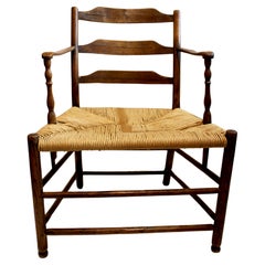 Chaise à accoudoirs à dossier échelonné du début du 19e siècle, de style campagnard français