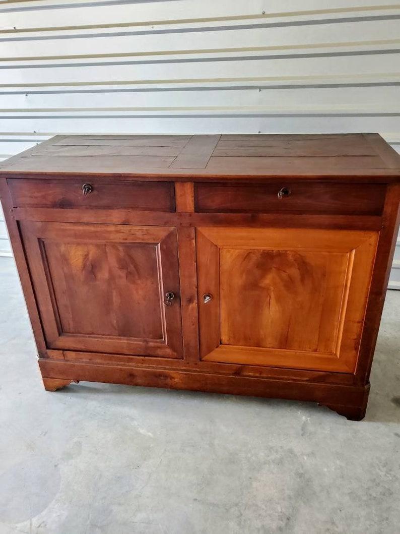 A period Louis Philippe (1830-1848) country French farmhouse walnut enfilade with double drawers over double doors. Circa 1830

Born in Provincial Southern France during the Bourbon Restoration of the first half of the 19th Century.

The most