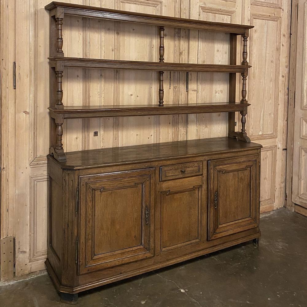 Early 19th century country French Rustic Vaisselier buffet was designed to serve three purposes! Store most of your family's china, flatware and table linens in the spacious buffet below, display your finest heirlooms in the open shelving above, and