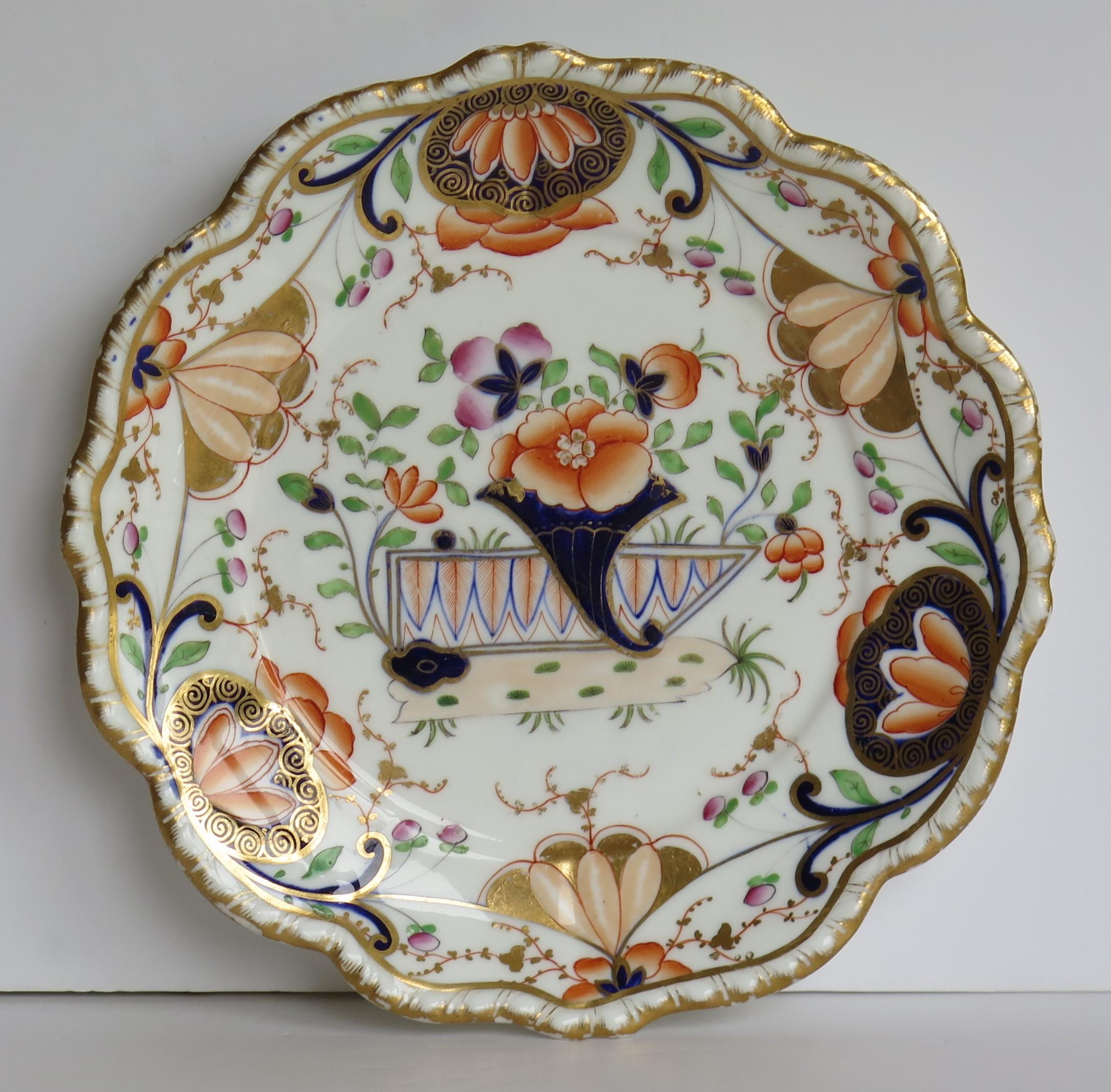 This is an early 19th century porcelain desert dish with a molded wavy edge to the rim, made by one of the quality Staffordshire, English potteries and dating from the George 111rd period, circa 1820 to 1830.

This piece is unmarked to the base