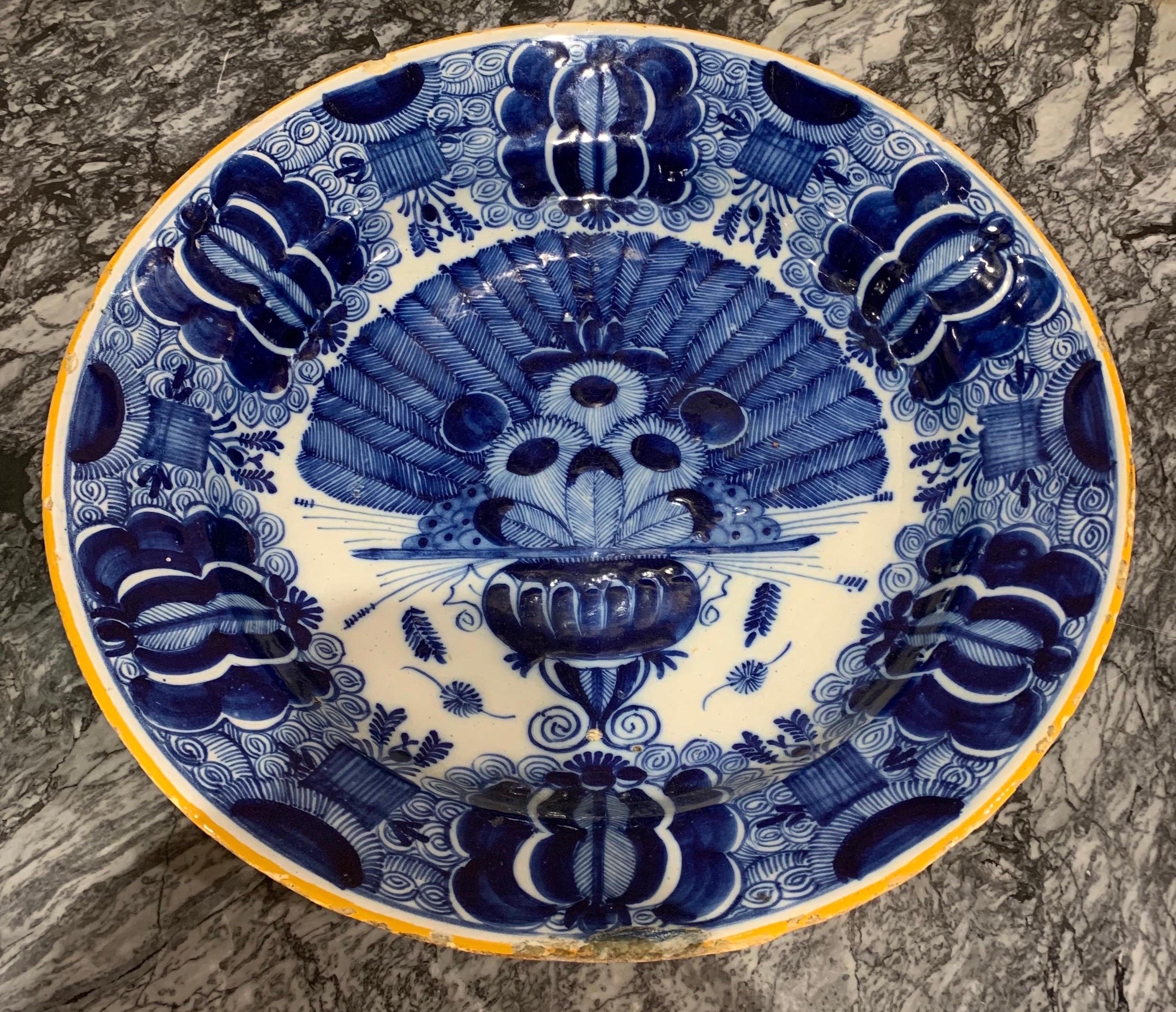 Early 19th century Dutch delft peacock pattern bowl. Measures: 13.75” diameter/2.75” deep.