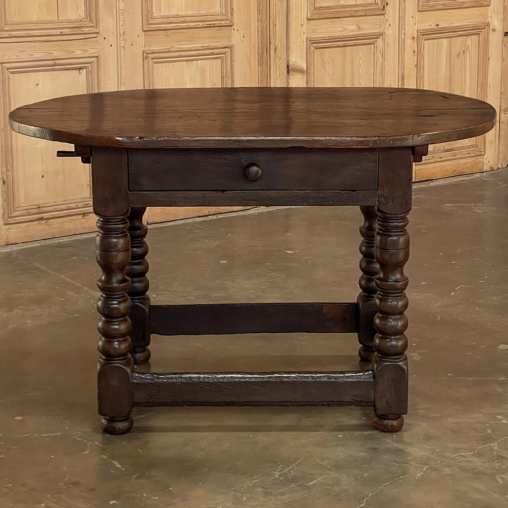 Early 19th century Dutch end table was fashioned from solid planks of old-growth oak to literally last for centuries! The thick plank top features completely rounded ends so that no corners exist in the design. The top is affixed to two runners that