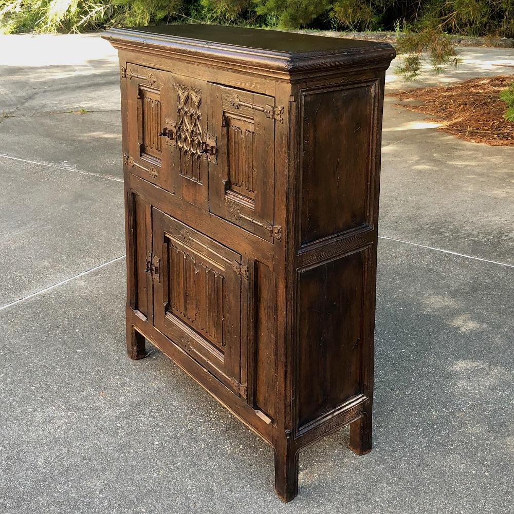 Early 19th century Dutch Gothic cabinet makes a great choice where a little storage is needed in a cozy spot. Hand carved and crafted from solid old-growth oak to last for centuries, it features pegged mortise & tenon joinery and timeless Gothic
