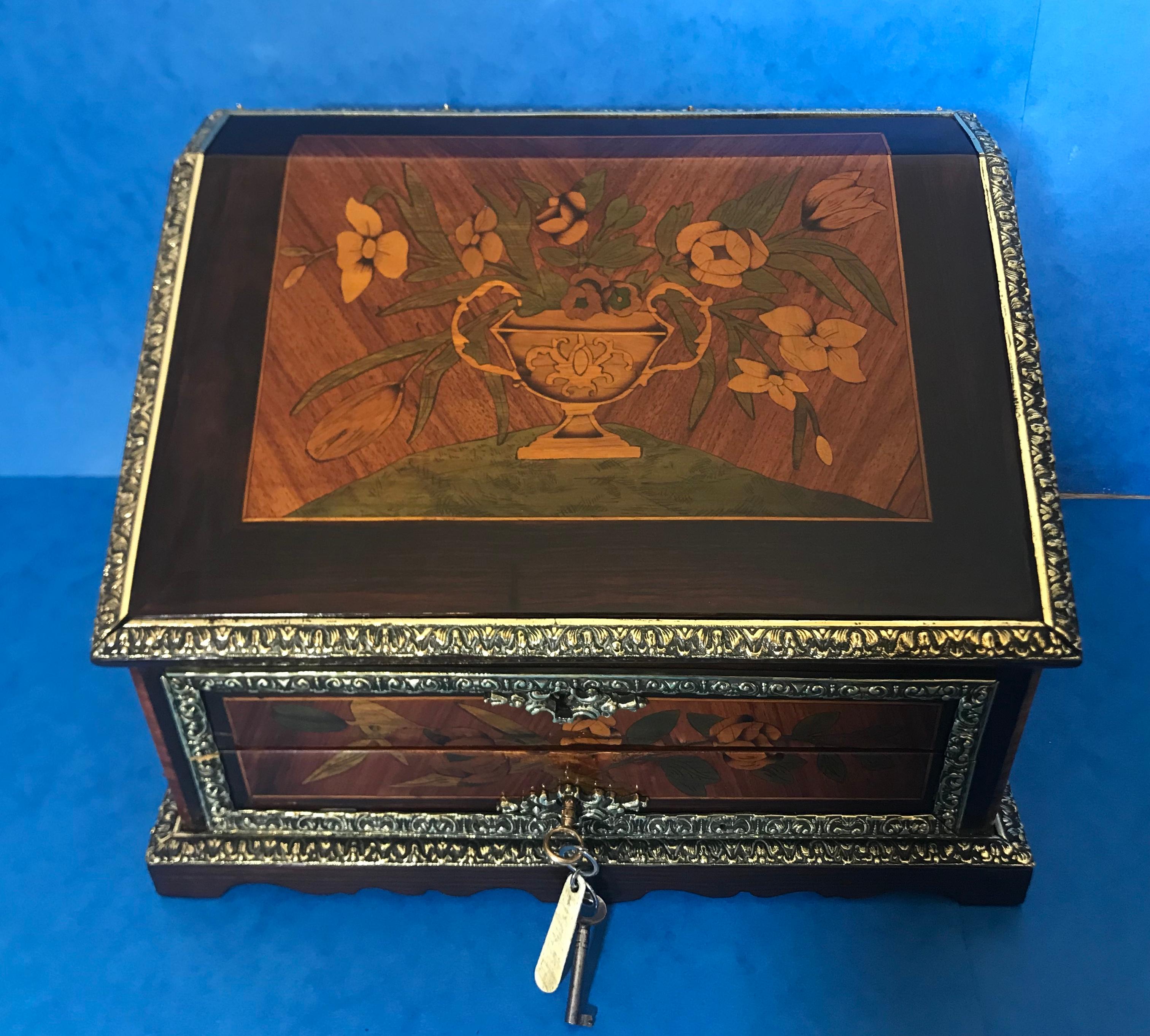 Early 19th century Dutch marquetry miniature bureau.
A magnificent circa 1830 floral marquetry miniature Bureau/Jewellery box in Rosewood, tulipwood, Harewood and boxwood. The box would have started life as a stationary box. It has a wonderful