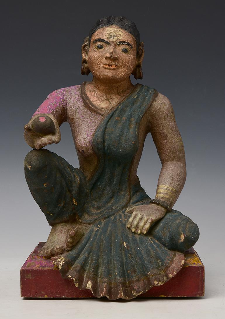 Antique Burmese wooden seated lady.

Age: Burma, Early Mandalay Period, Early 19th century
Size: Height 35.5 C.M. / Width 22.8 C.M. / Depth 25 C.M.
Condition: Nice condition overall (some expected degradation due to its age).

100% satisfaction and