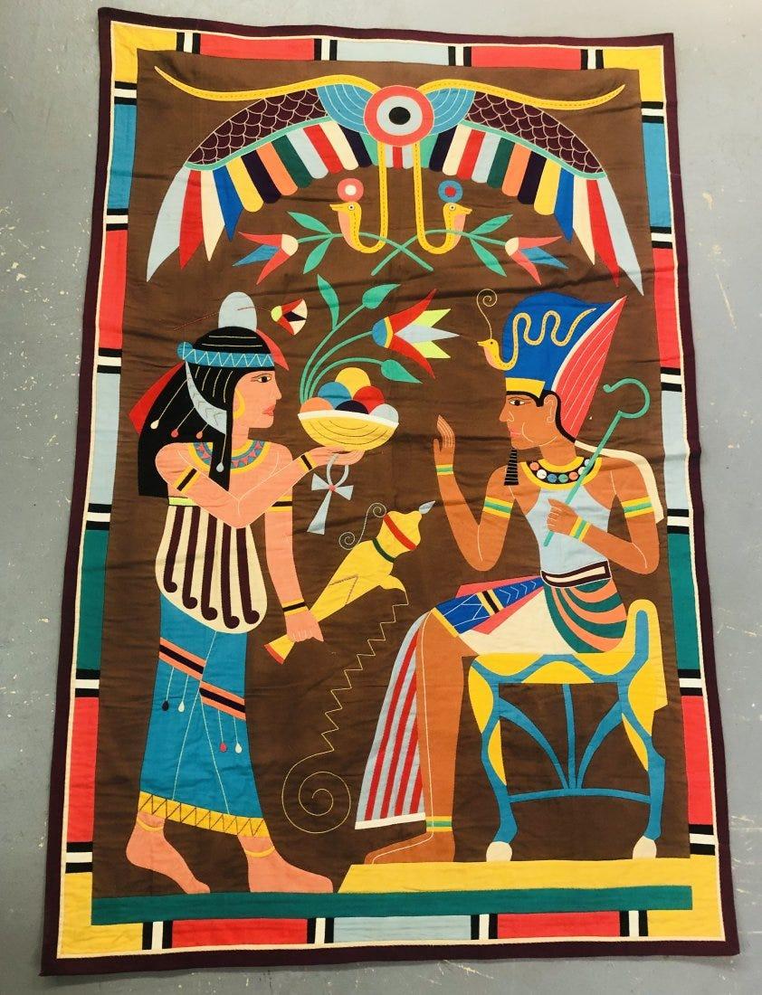 An 1940's Egyptian cotton applique tapestry featuring vibrant colors and showing fine and intricate ancient Egyptian folk art design. The textile is a depiction of the opulent Pharaohs tombs also known as sarcophagus. 
A timeless piece that will