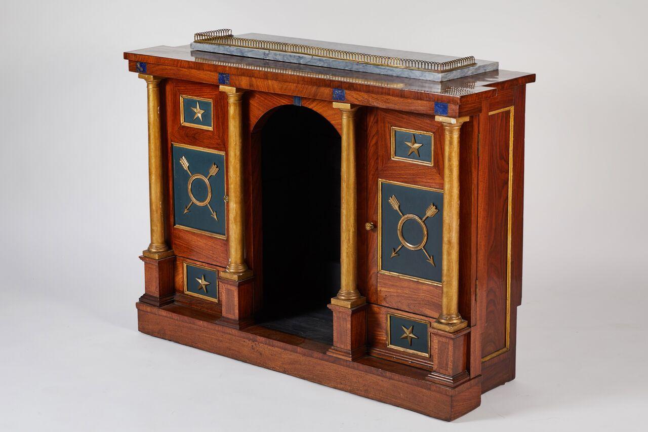This stunning console from the early 19th century in Rosewood, Mahogany, and bronze has parcel-gilt columns and faux lapis details with gray marble top with brass gallery. The niche provides an unusual and unexpected place to feature a sculpture or