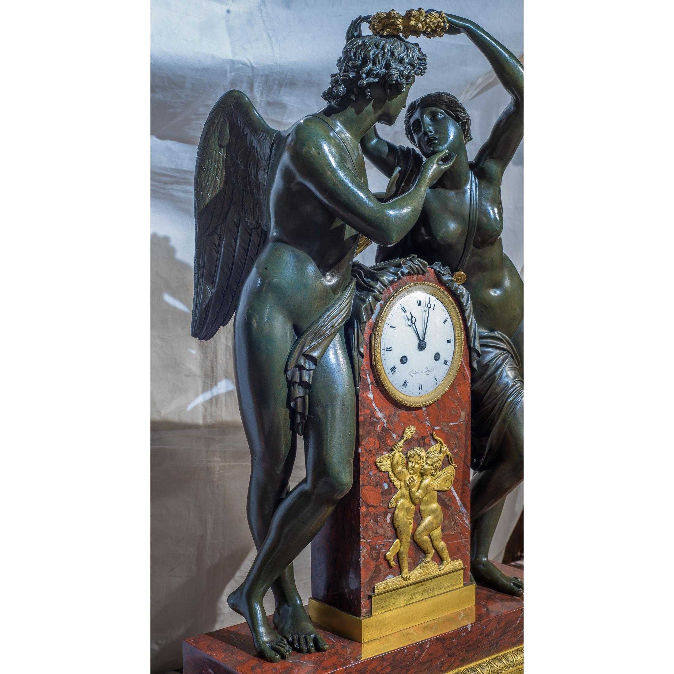 A fine quality empire ormolu-mounted patinated bronze and rouge royale marble mantel clock.
The patinated bronze figures depicting cupid and psyche. Attributed to Pierre-Victor Ledure after the model by Claude Michallon, dial signed Lesieur à Paris