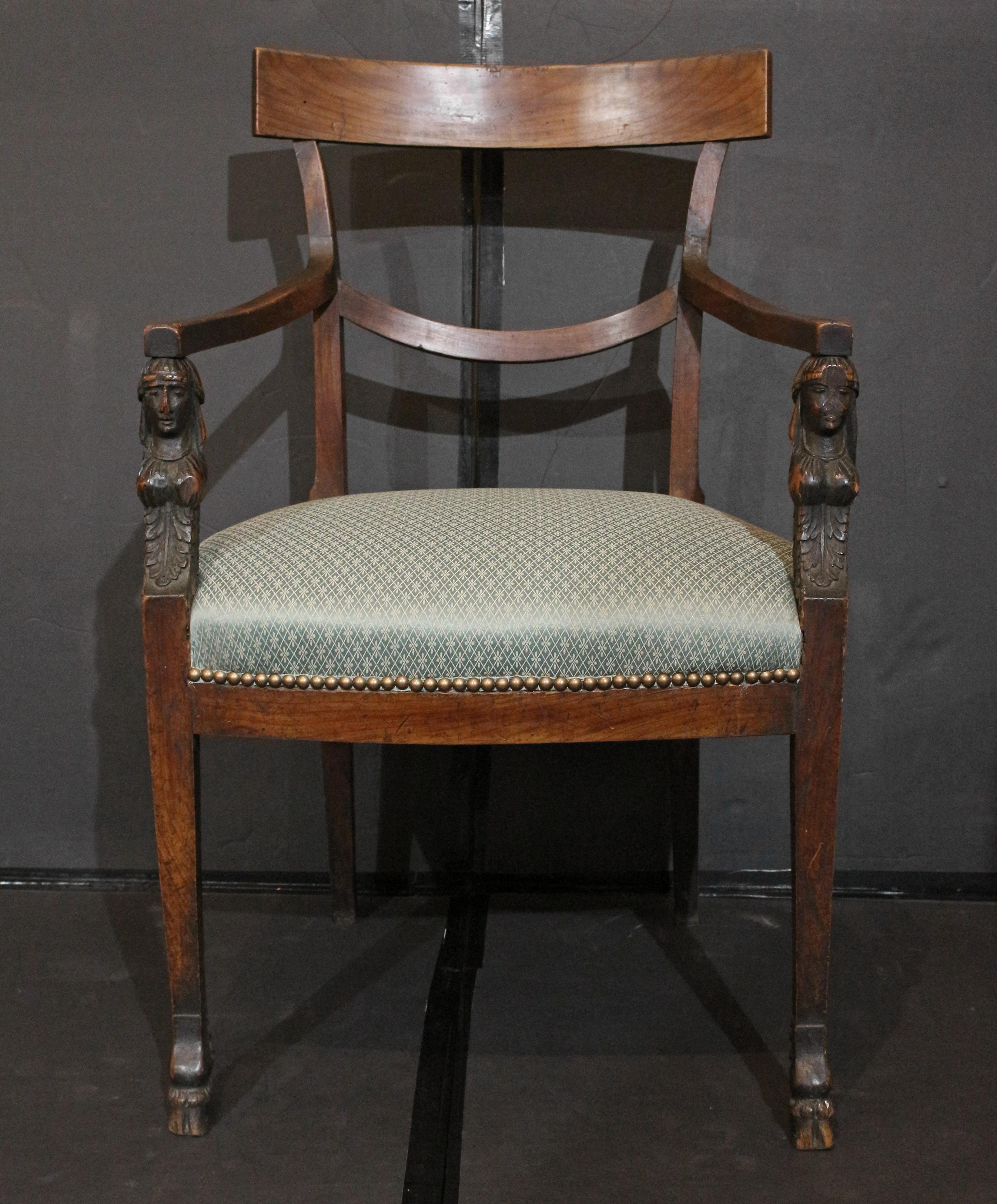 Early 19th century Empire period fauteuil (or open arm chair), French. Curved open back with graceful curved cross bar. The straight, tapered front legs surmounted by carved Egyptian busts of women (one's face quite worn) over acanthus leaf carving