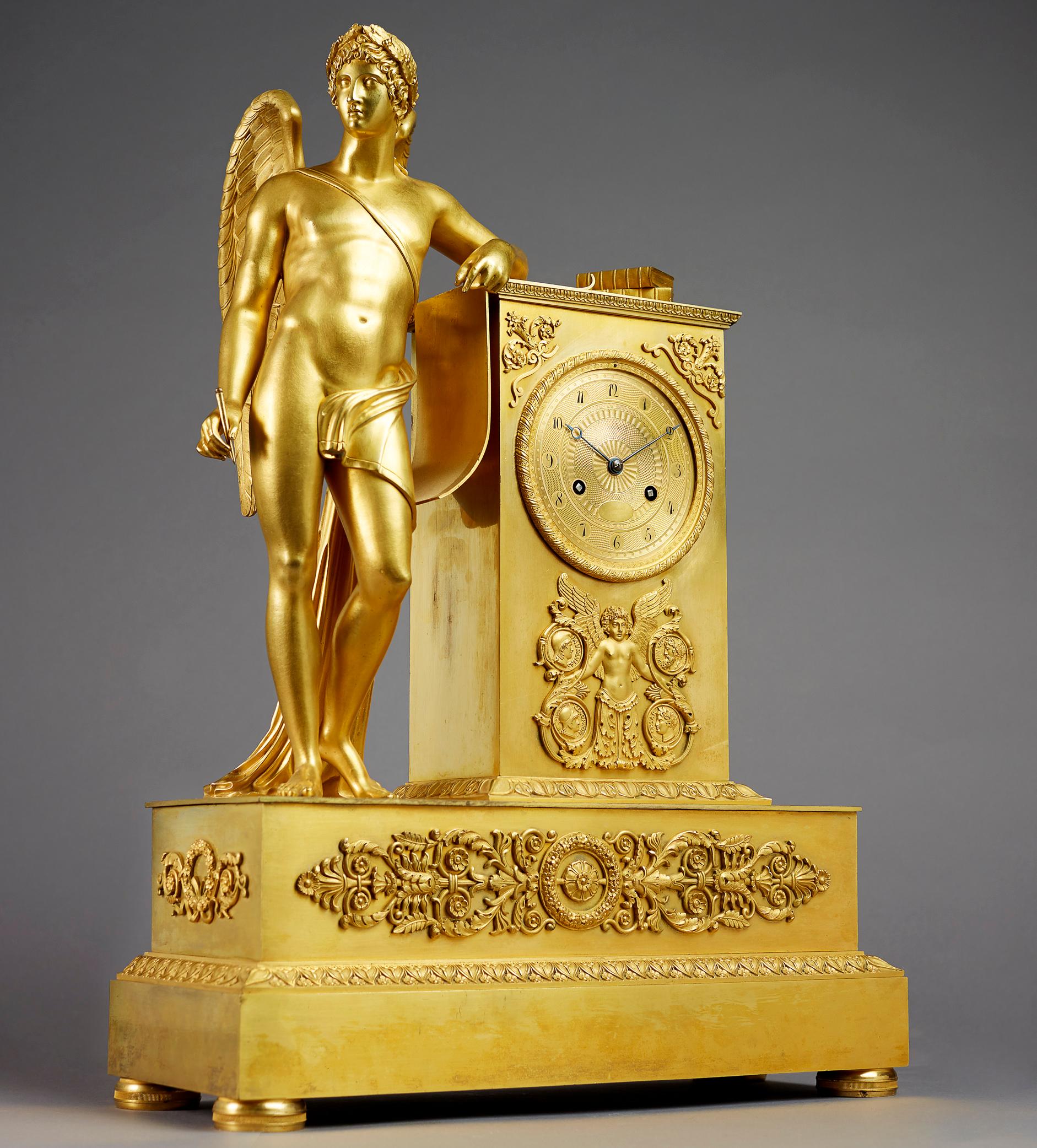 The clock is signed on the dial by the Parisian bronzier Pierre-Victor Ledure and the clockmaker Claude Hemon (almost invisible). Winged Apollo, fully sculpted nude male figure with wings holding a pen and resting against the a rectangular clockcase