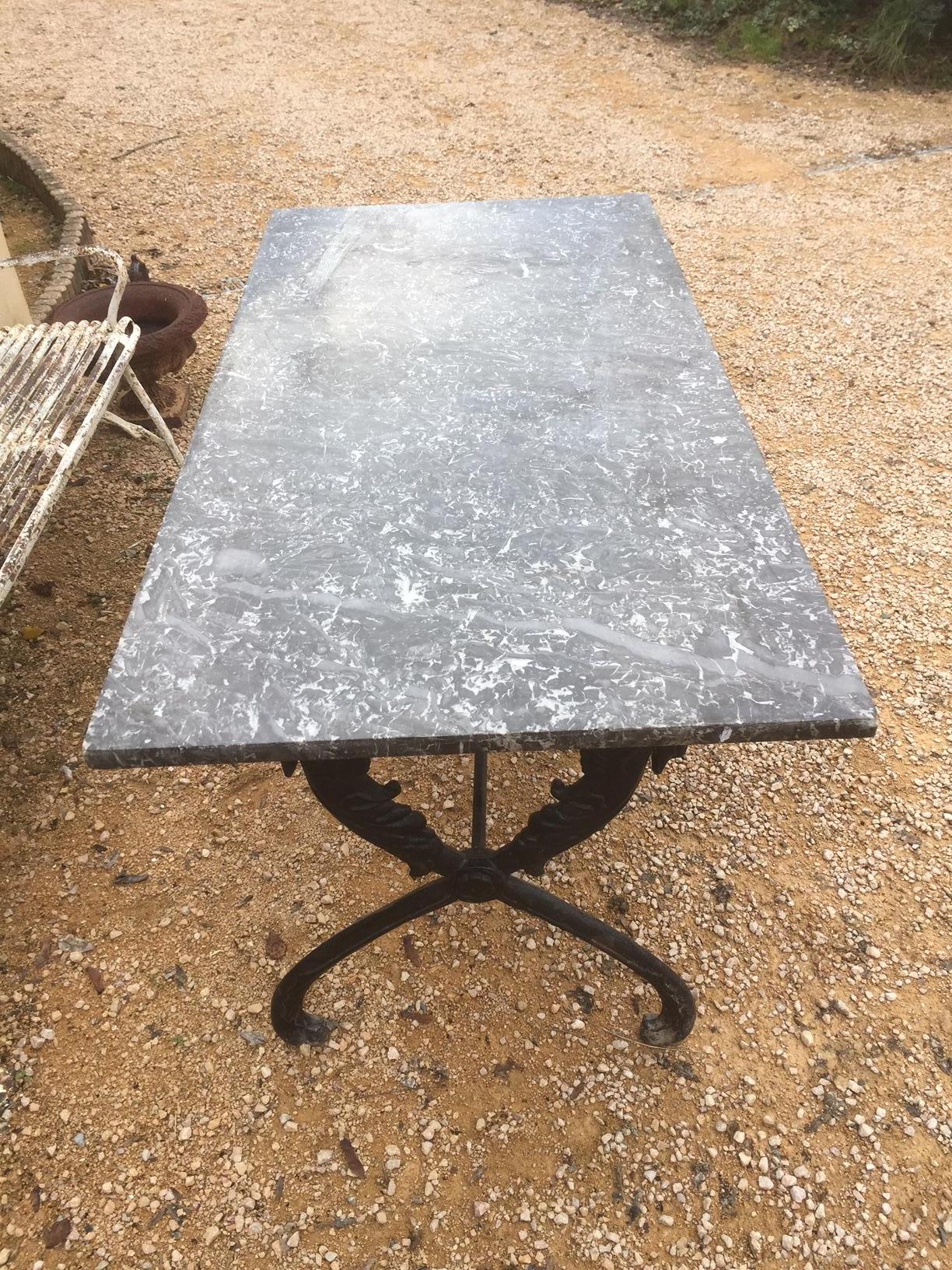 Beautiful early 19th century Empire period gooseneck base marble table.
The marble top is removable from the base. The base is made with melt and represent two gooseneck on each side.
Very nice quality.